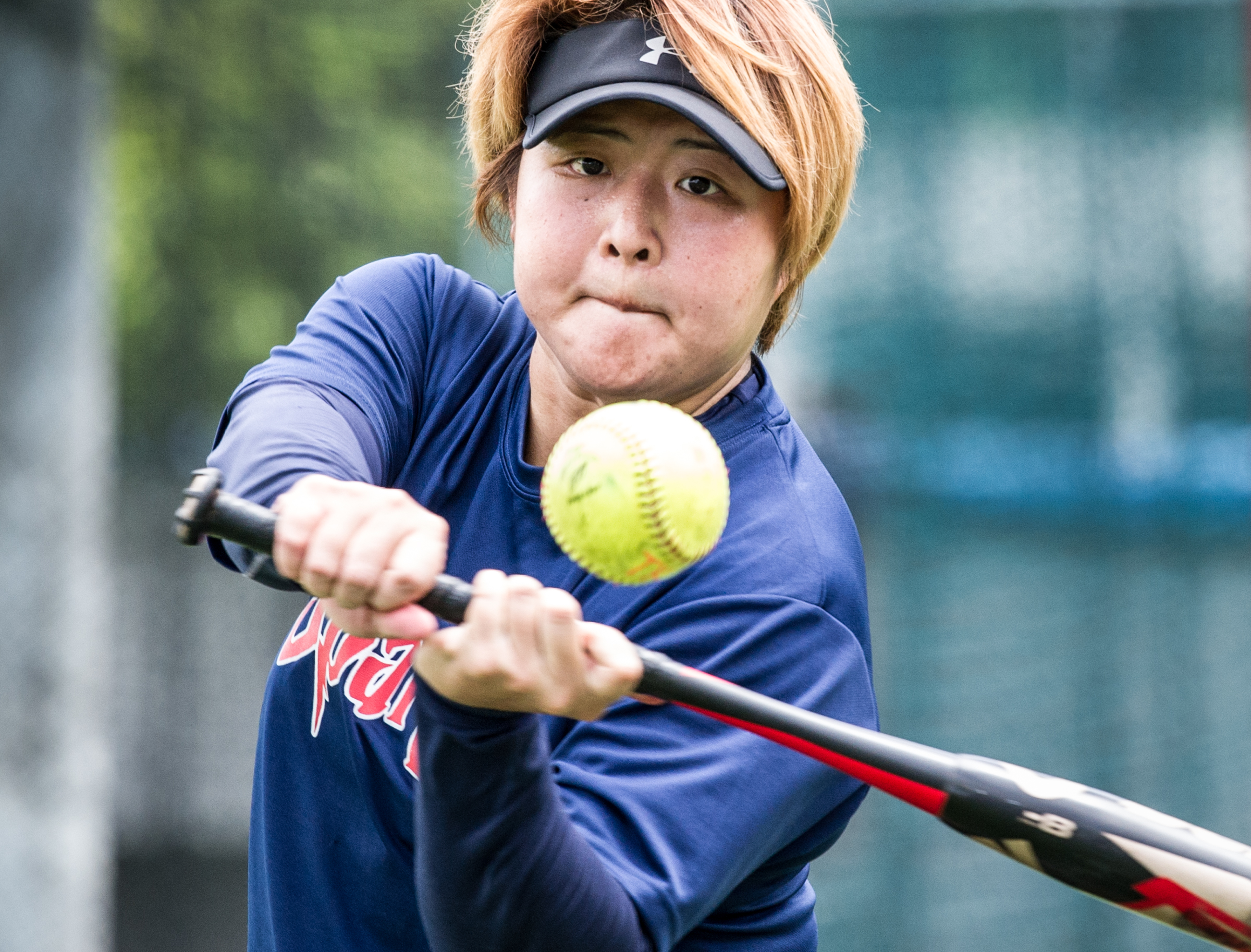A Singaporean player prepares to hit the ball during the ORA Gryphon Cup slow pitch tournament at Raffles Institution.