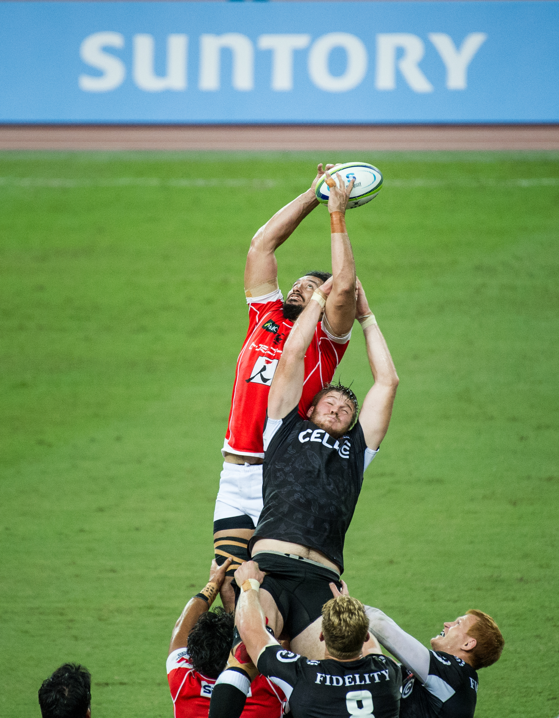 A South African and Japanese player at a line out during a Super Rugby match at the Singapore Sports Hub.