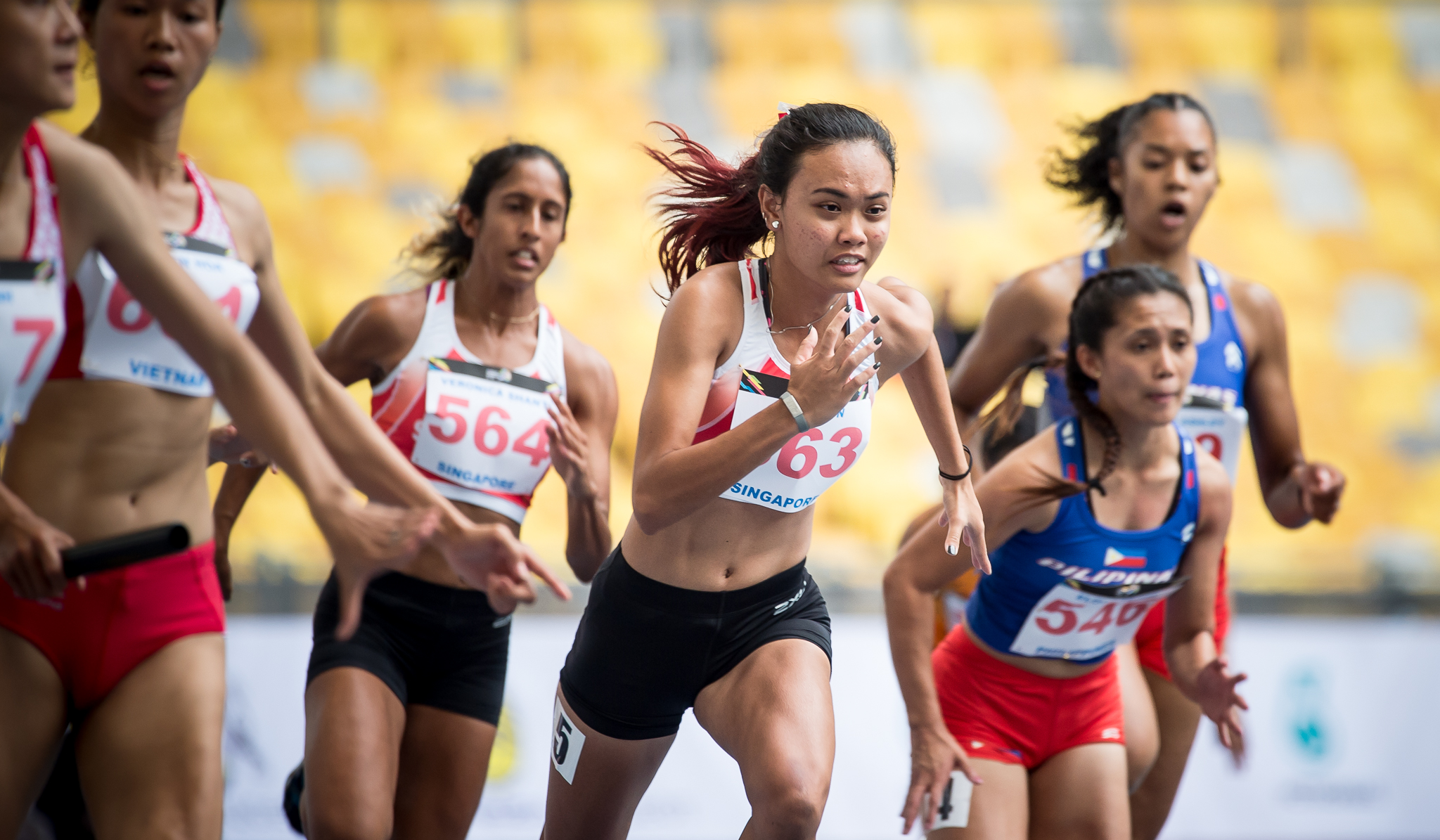 A Singaporean sprinter in action during the SEA Games at the Bukit Jalil Stadium.