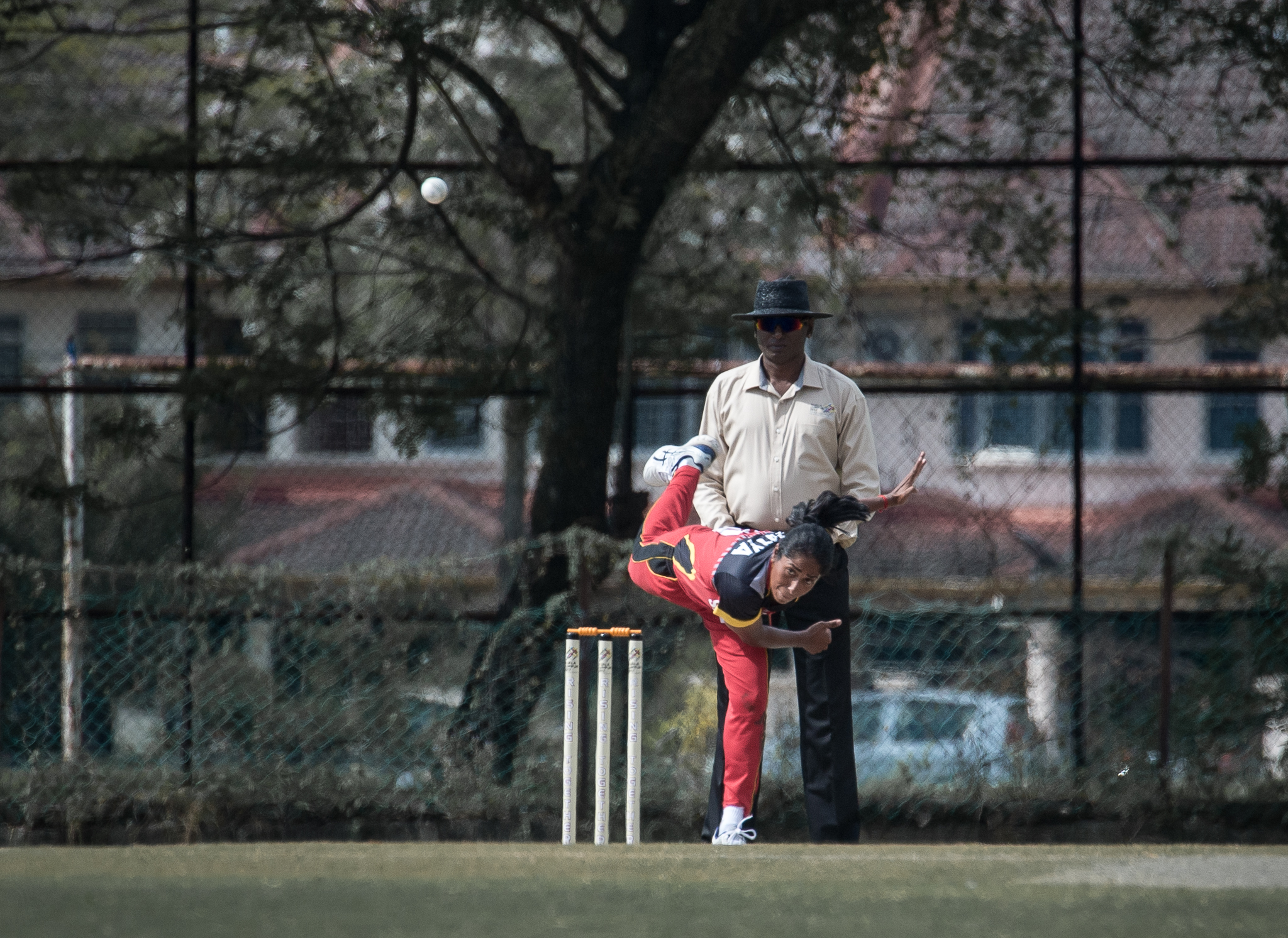 A Singaporean cricket player bowls during the SEA Games at the Kinrara Oval.