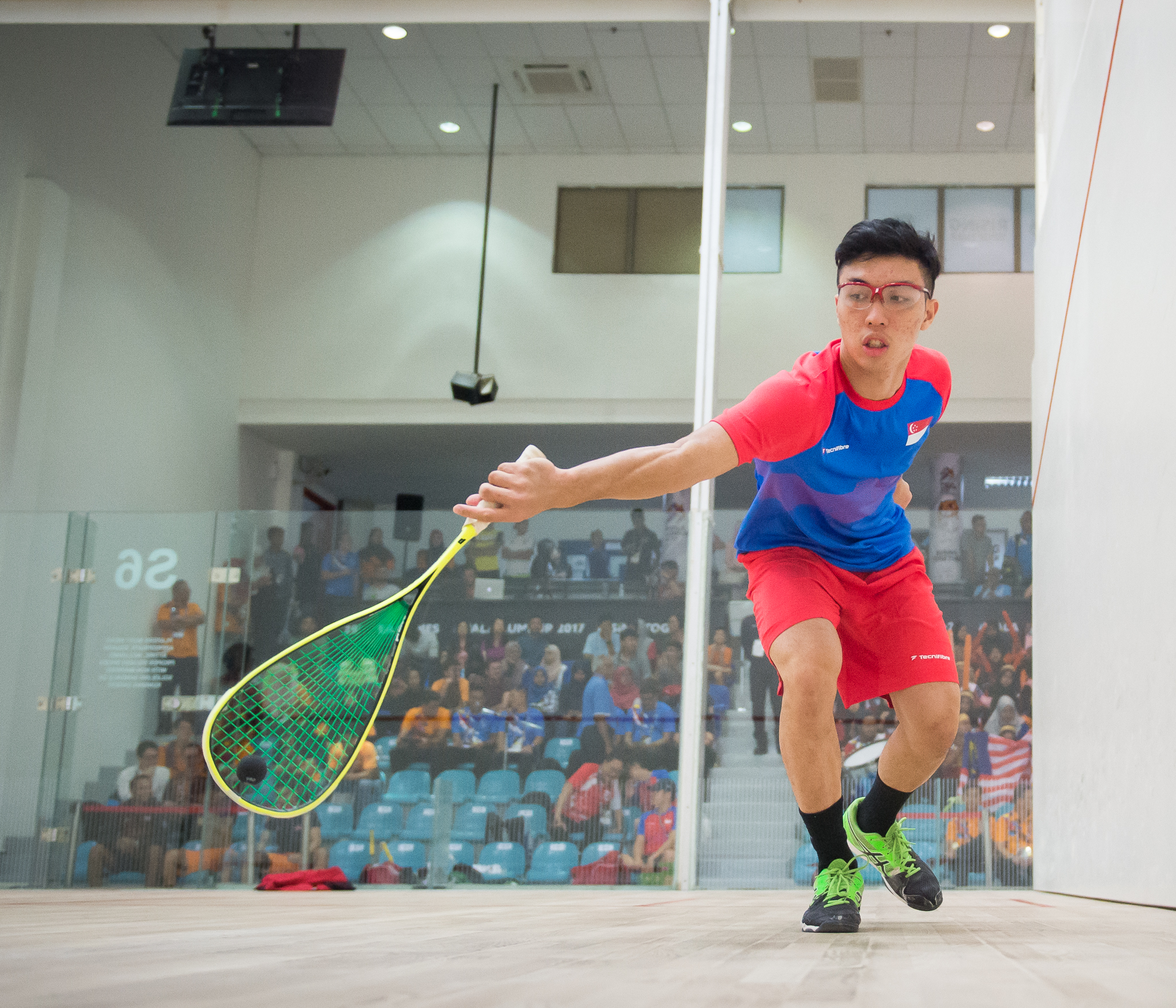 A Singaporean squash player in action during the SEA Games at the National Squash Centre, Bukit Jalil.