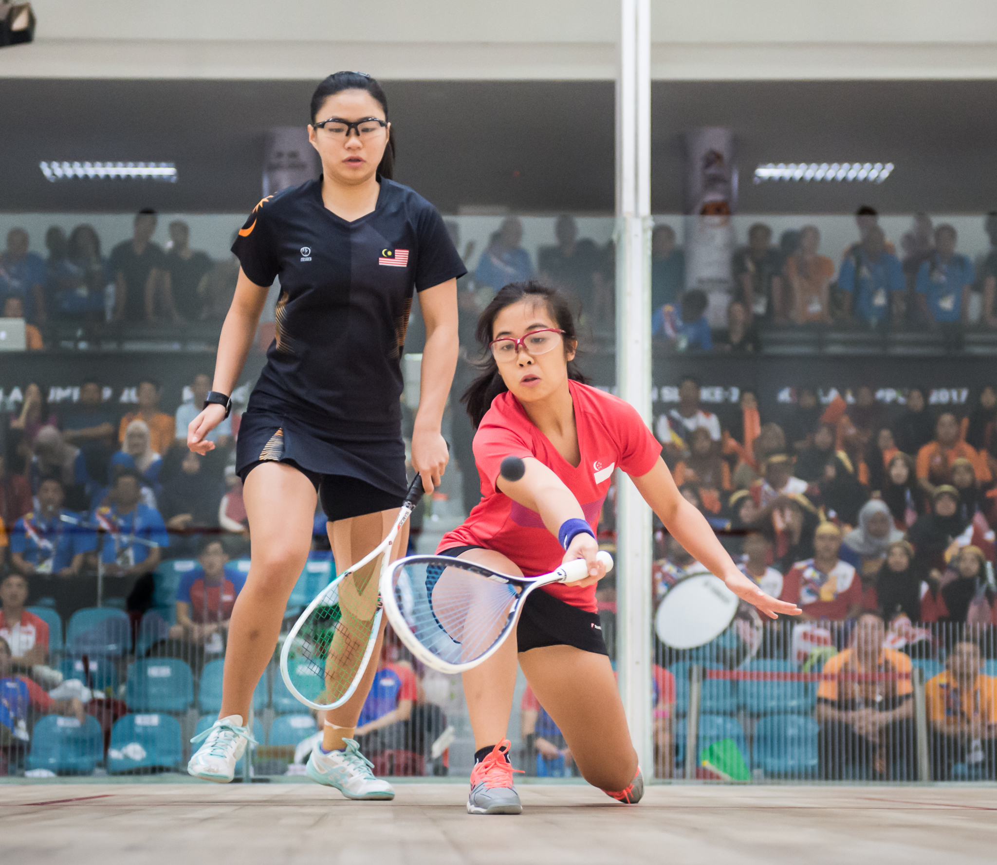 A Singaporean squash player in action during the SEA Games at the National Squash Centre, Bukit Jalil.
