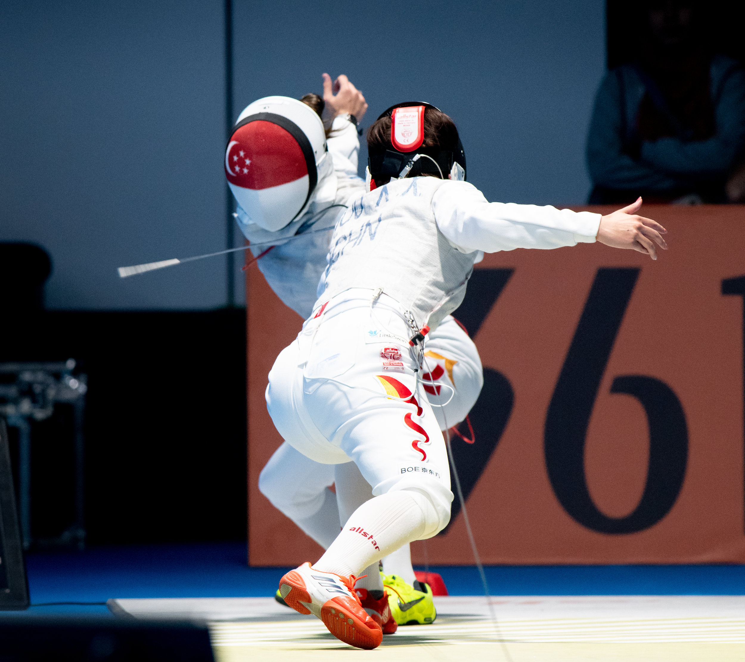 A Singaporean fencer during her women's foil event of the Asian Games at the Gelora Bung Karno Sports Complex.