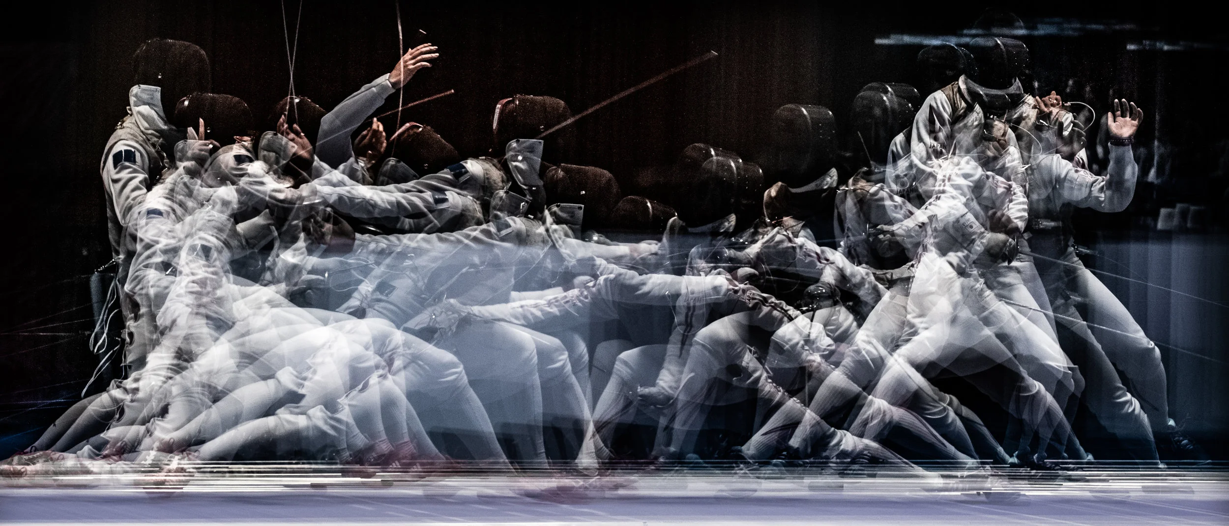 Japanese and Chinese fencers in action during the foil team finals of the Asian Games at the Jakarta Convention Centre.