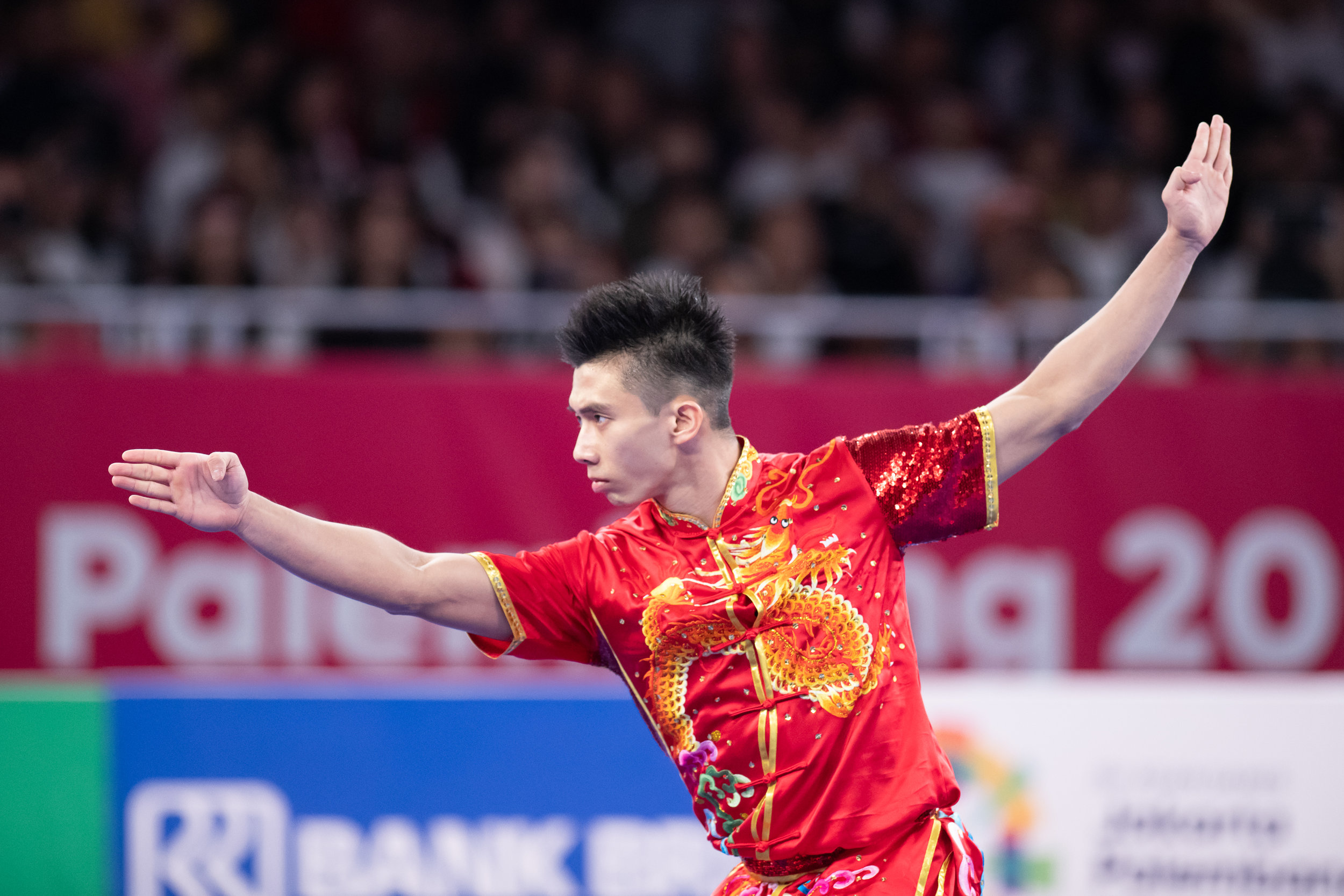 A Singaporean wushu exponent during the Men's Changquan event of the Asian Games at the Jakarta International Expo.