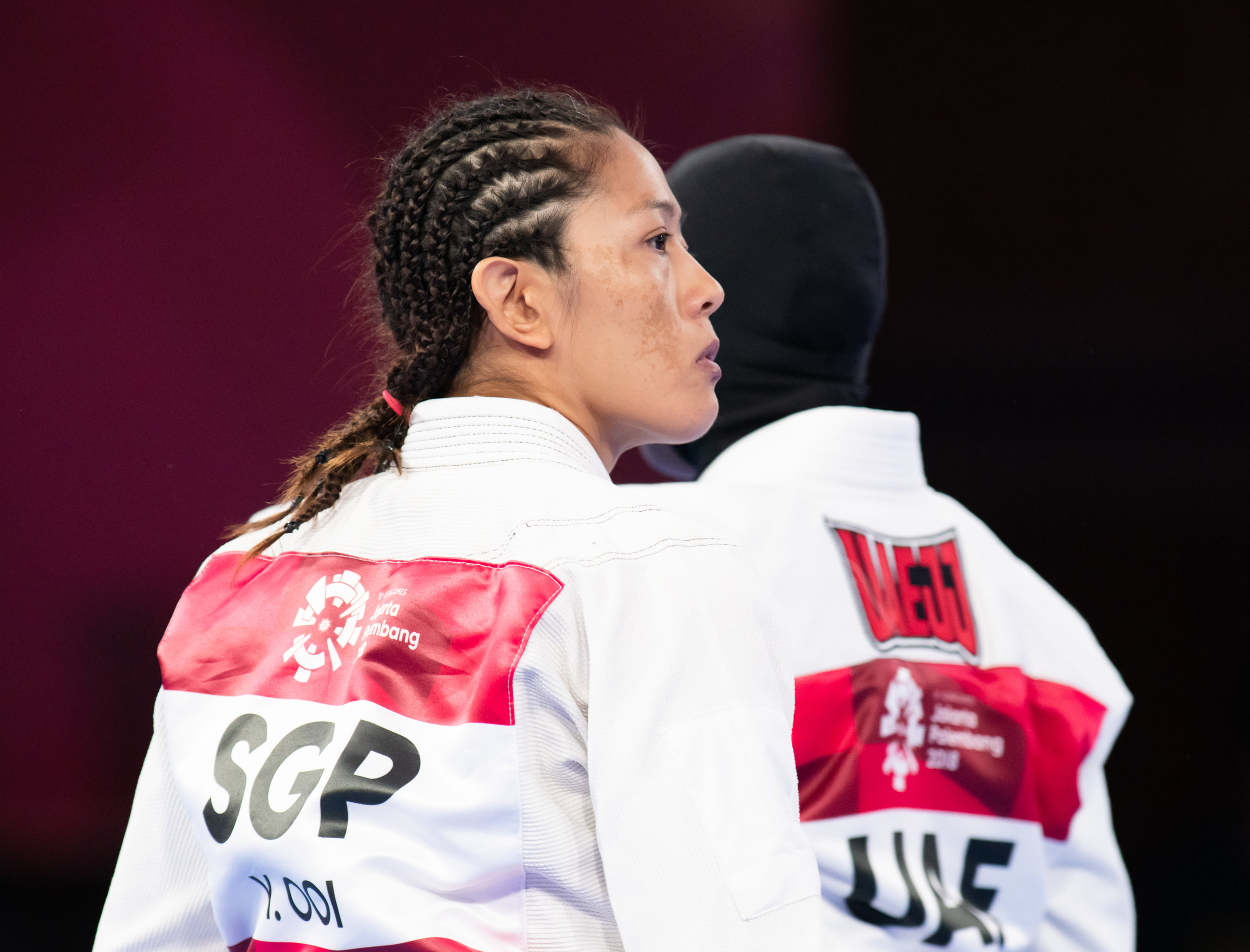 A Singaporean Jiu Jitsu exponent and her United Arab Emirates opponent during the Asian Games at the Jakarta Convention Centre.