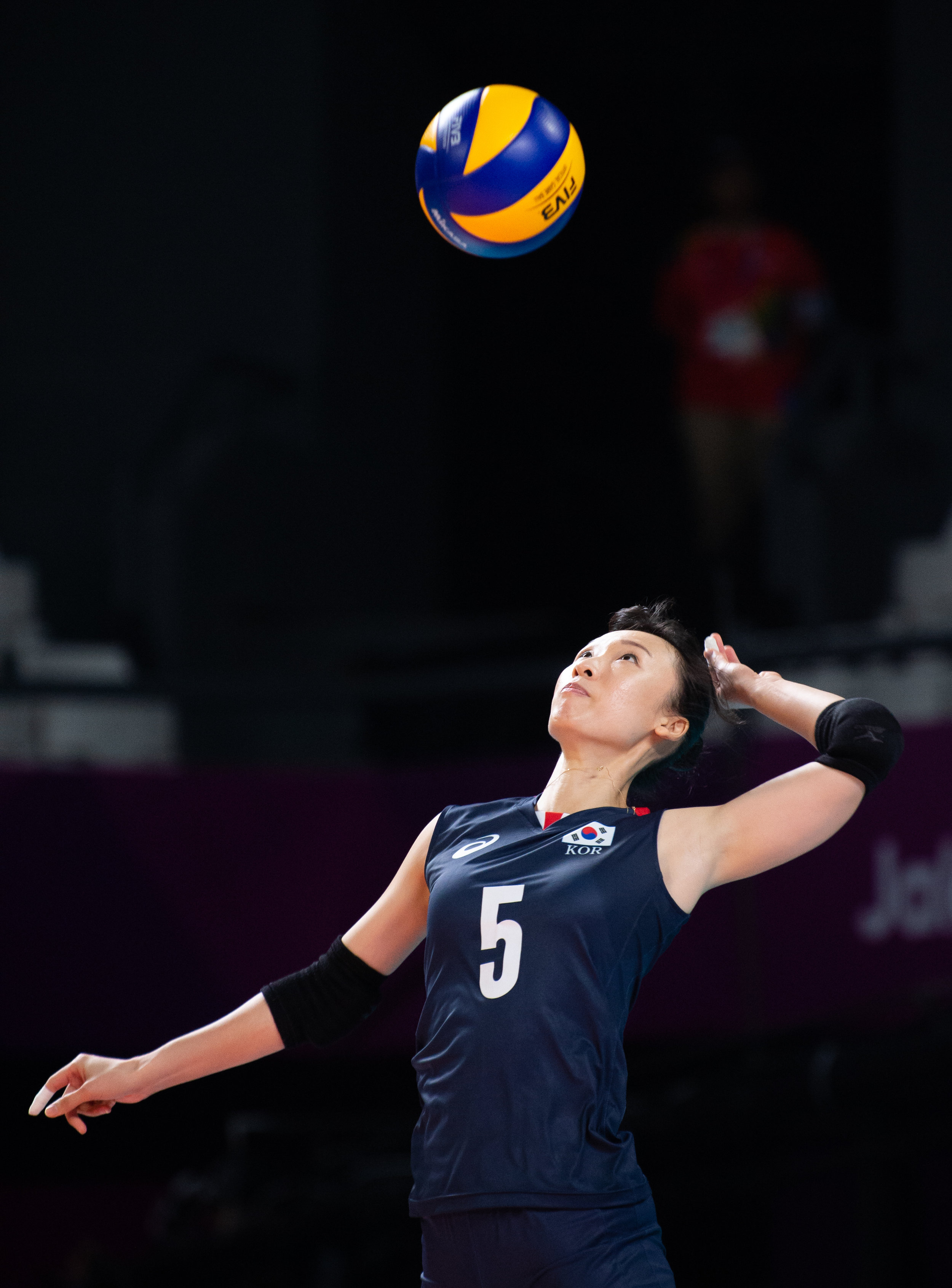 A Korean player serves during the Women's Volleyball match against Vietnam of the Asian Games at the Gelora Bung Karno Sports Complex.