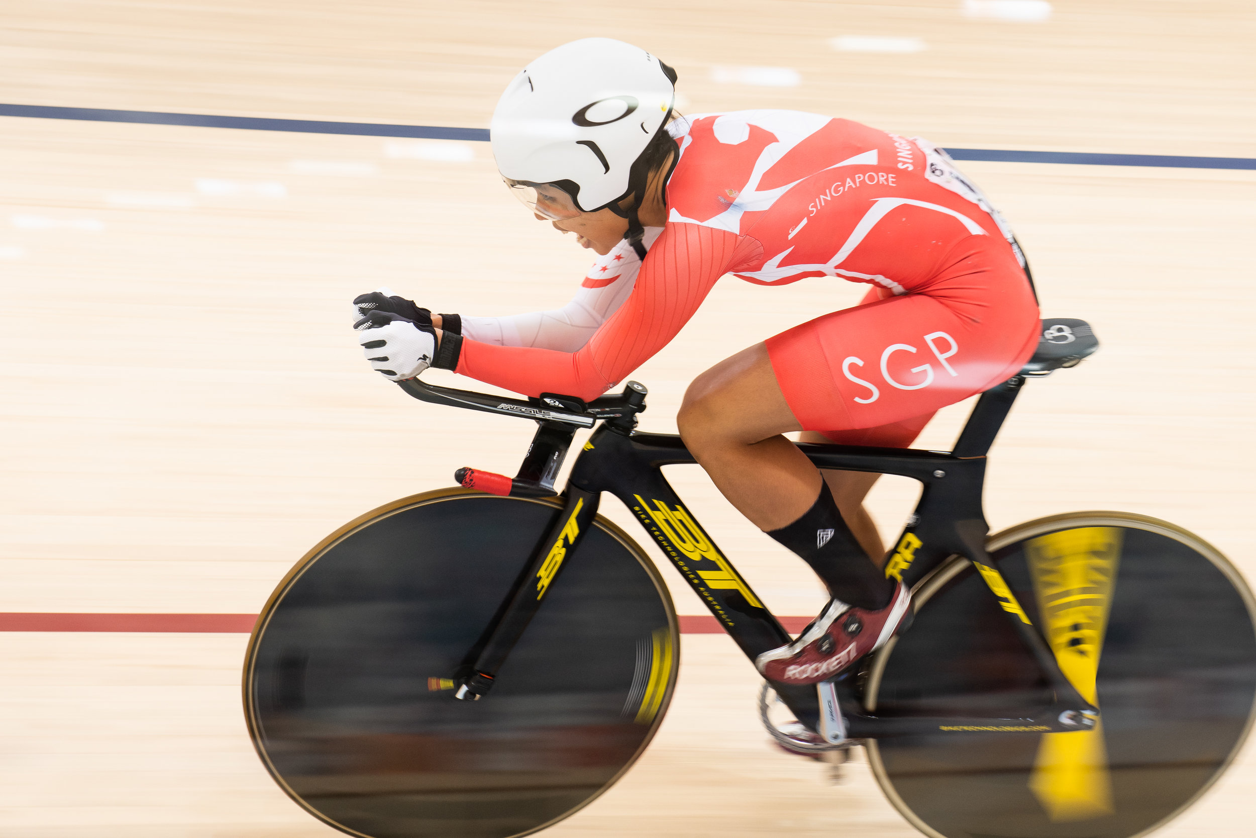 A Singaporean cyclist during the Asian Games at the Jakarta Velodrome.
