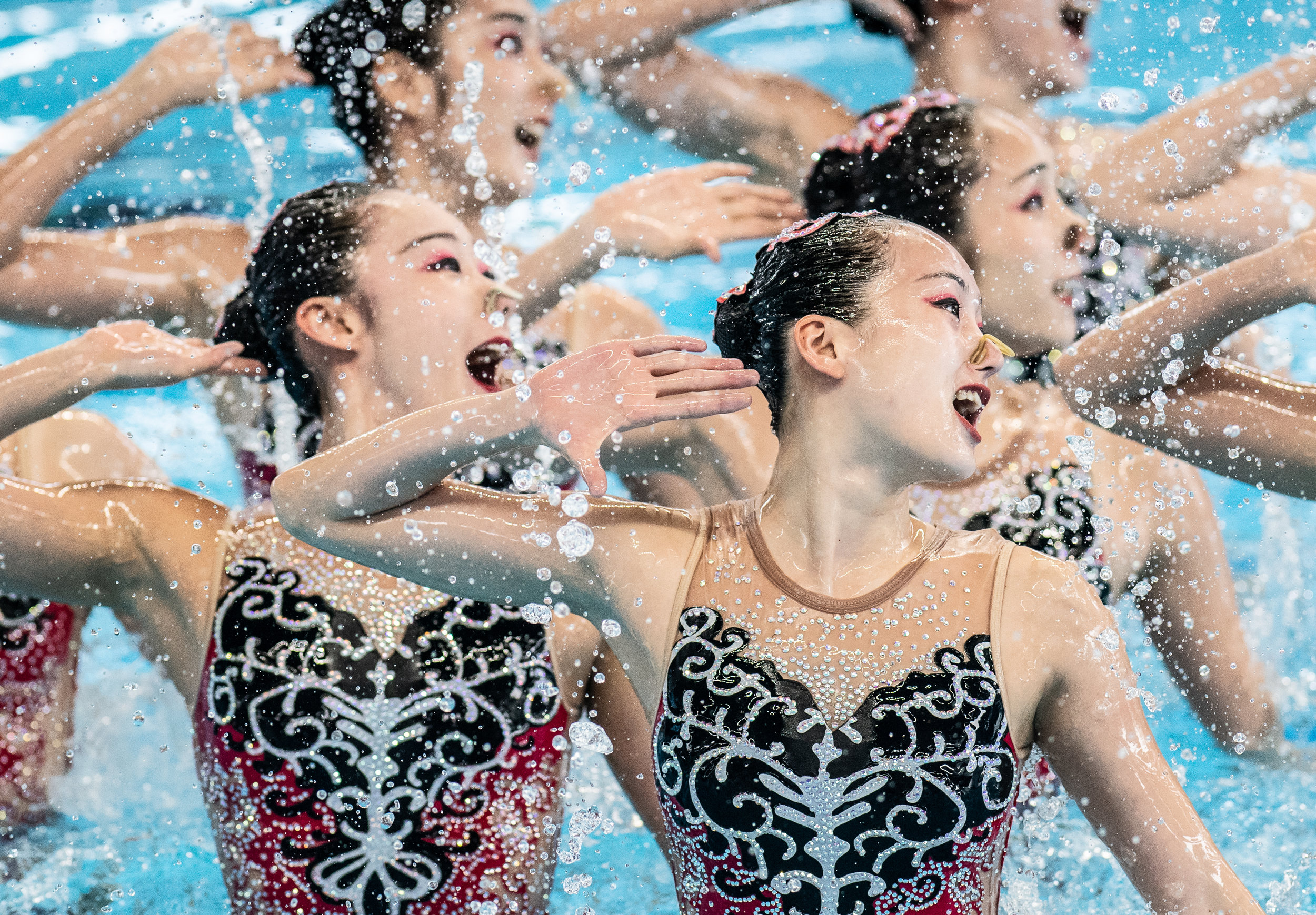 Chinese swimmers during their technical routine of the Asian Games at the GBK Aquatic Centre.