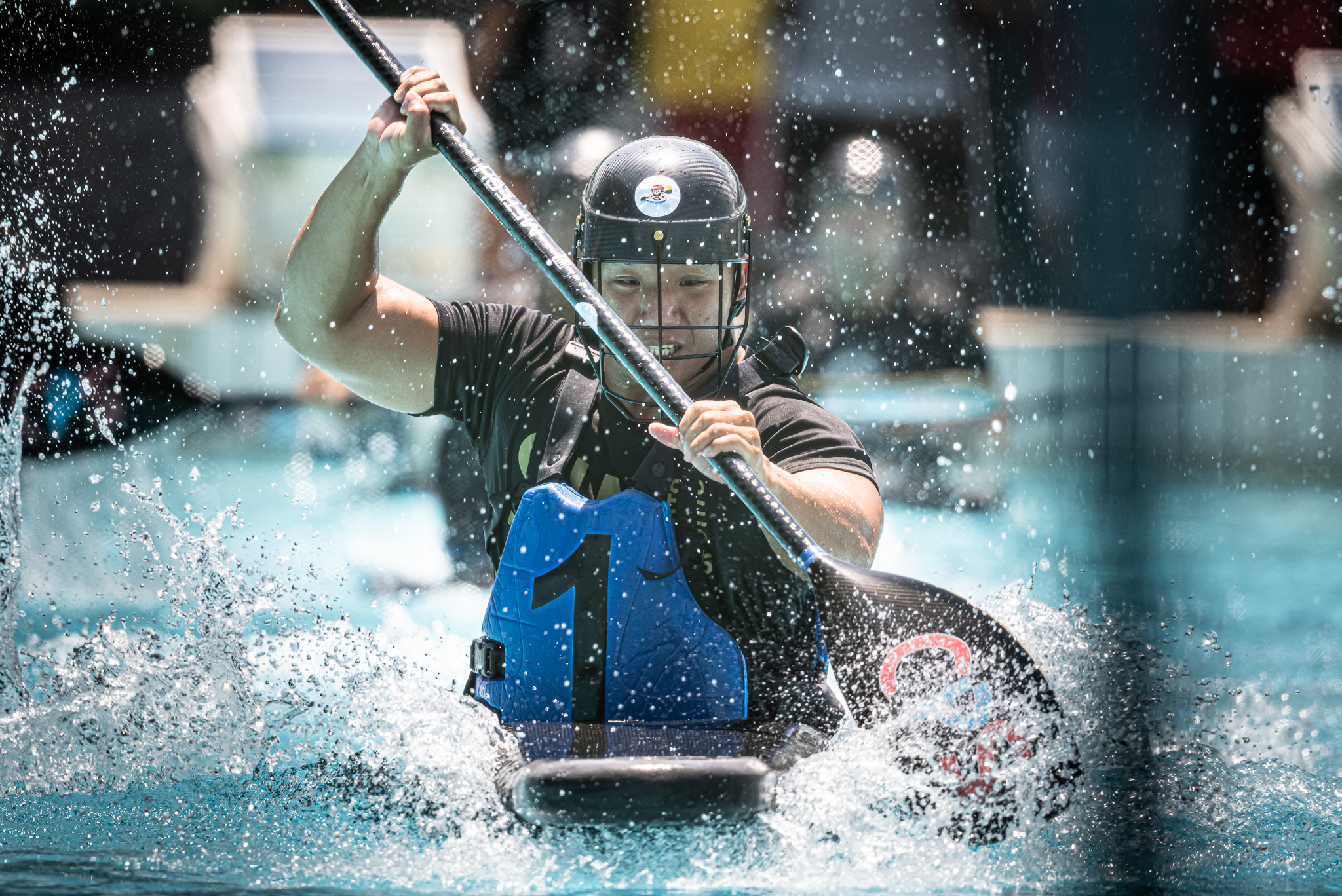 A Canoe polo player in action during the Pesta Sukan Canoe Polo Championships at Toa Payoh Swimming Complex.