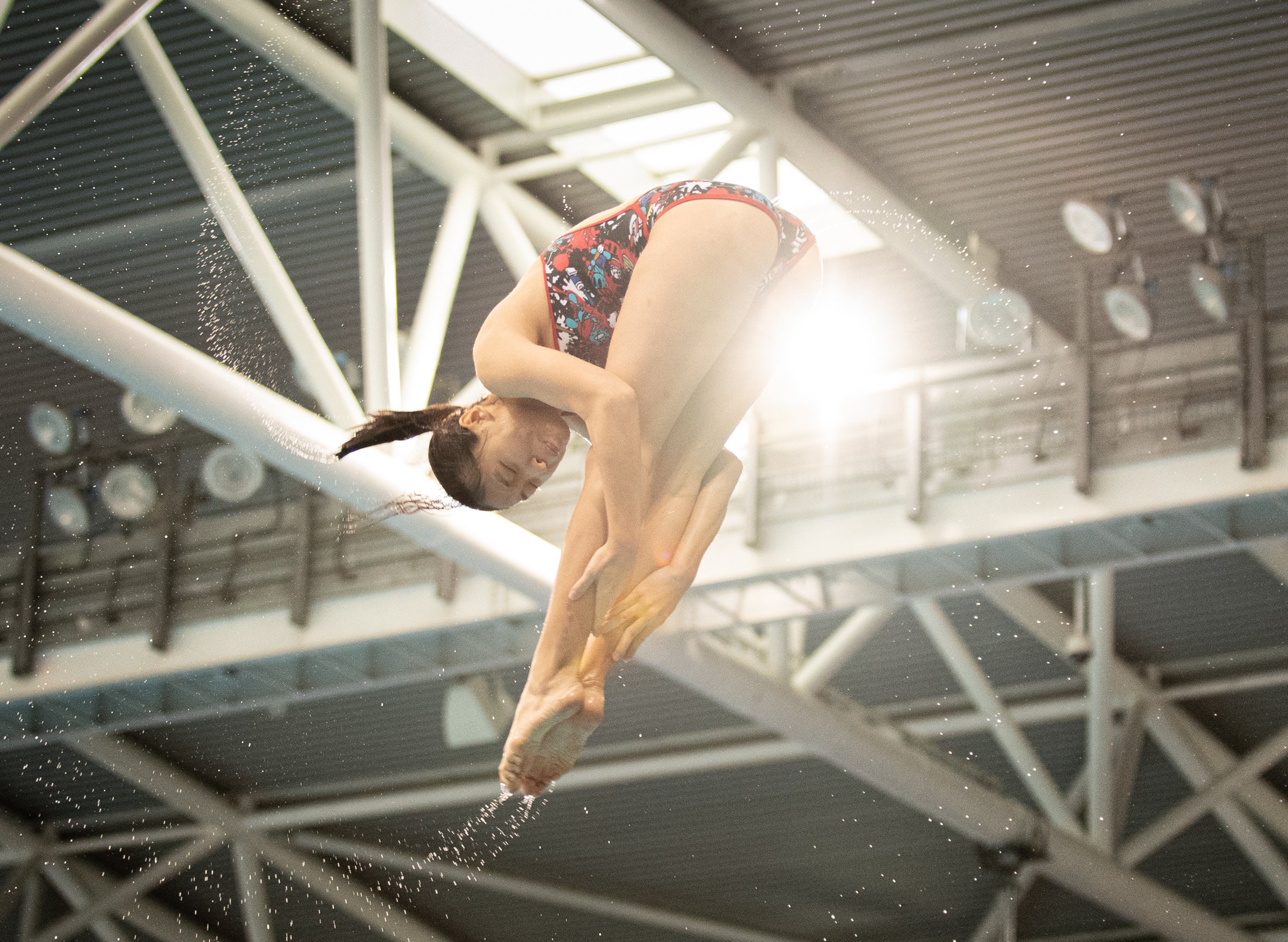 A Singaporean diver rotates in the air during the Singapore National Diving Championships at the OCBC Aquatic Centre.