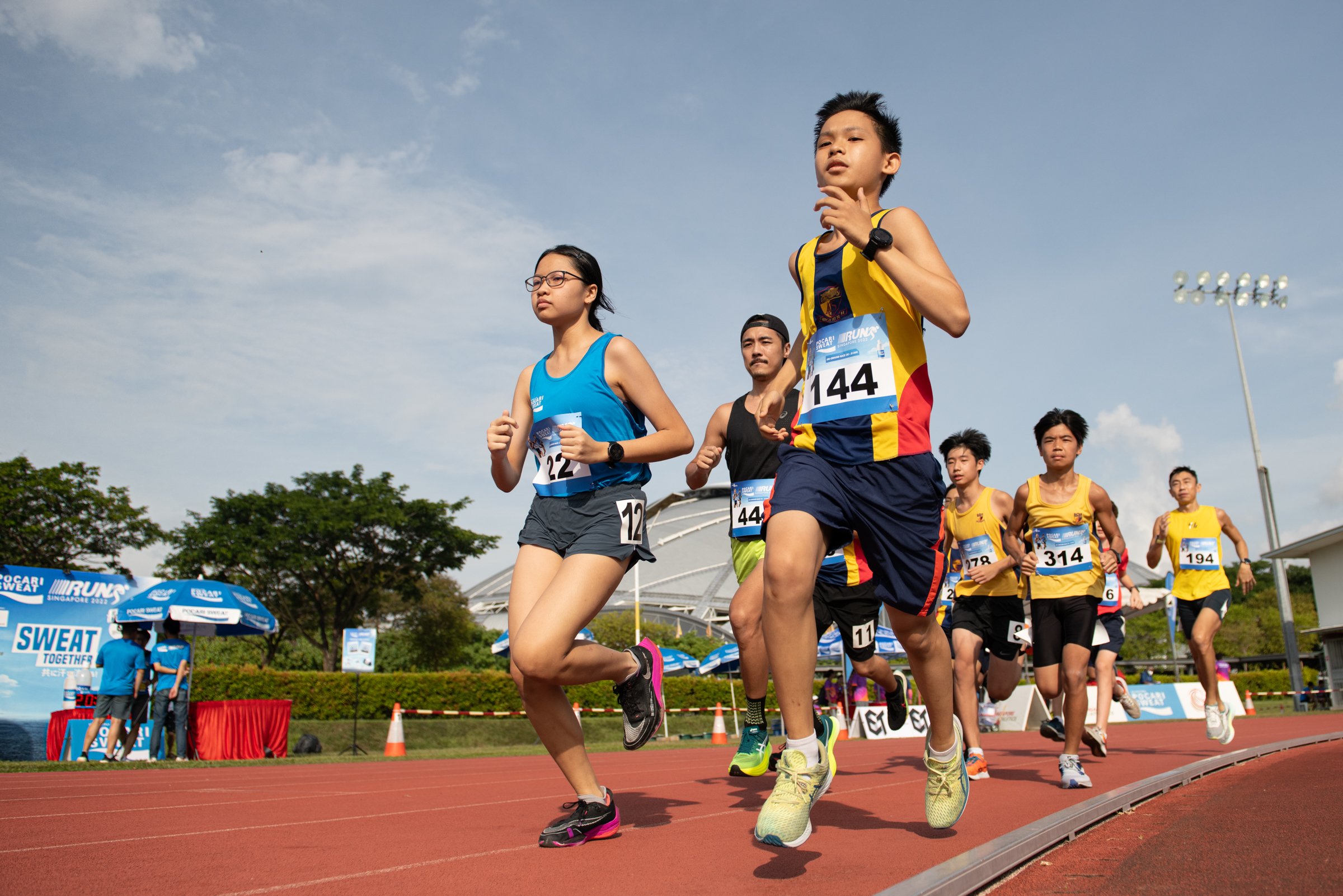 Athletes running during the Pocari Sweat 2.4km Challenge held at the Home of Athletics.