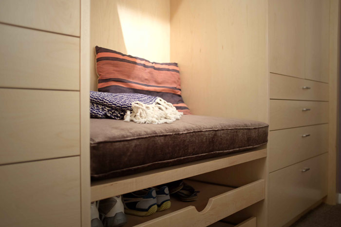 Custom cabinets with nook and drawers for shoes