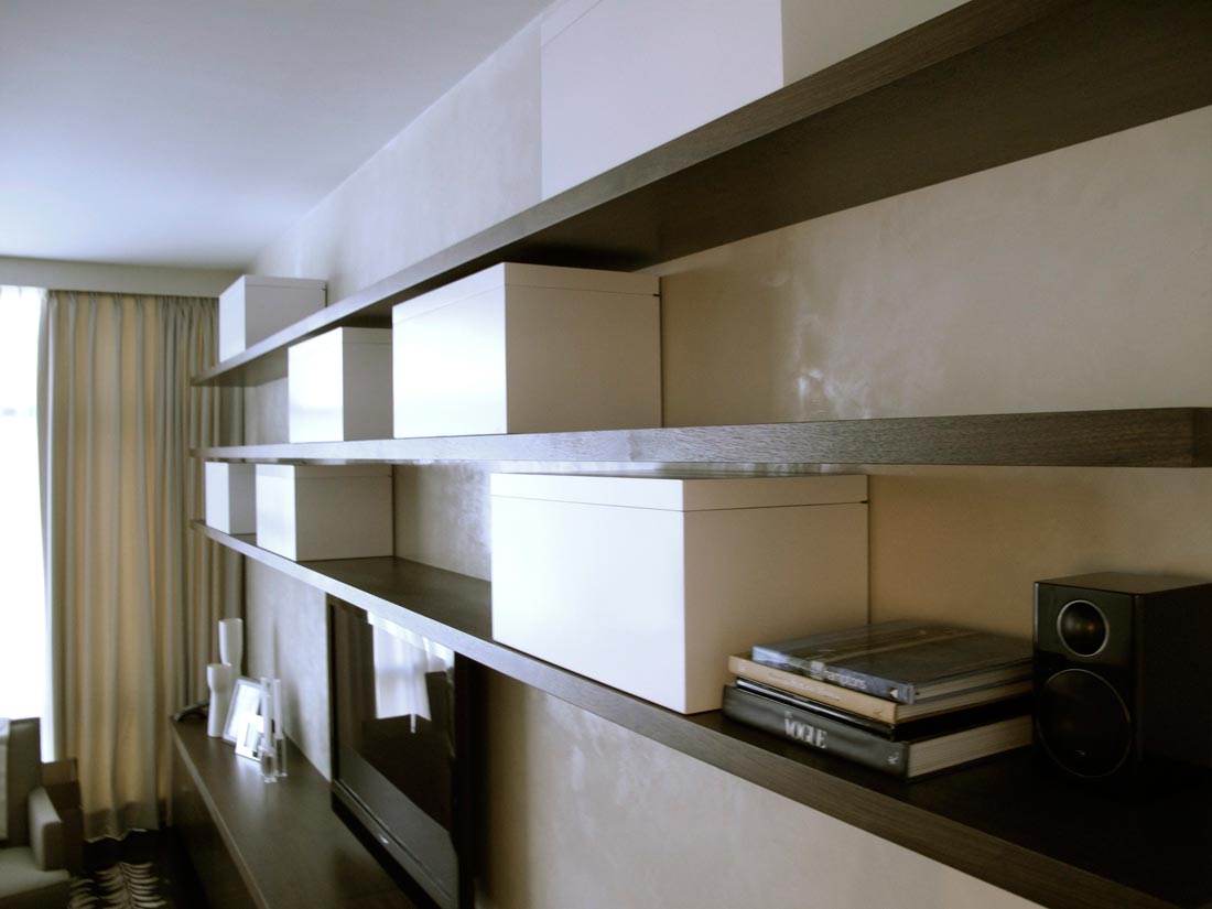Custom walnut true floating shelves