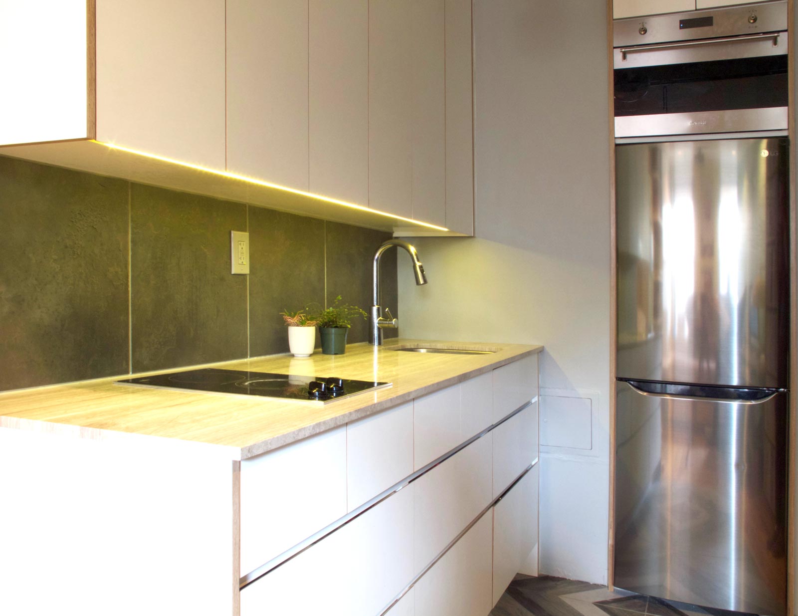 Strip lights were installed underneath the upper cabinets to illuminate the countertop.