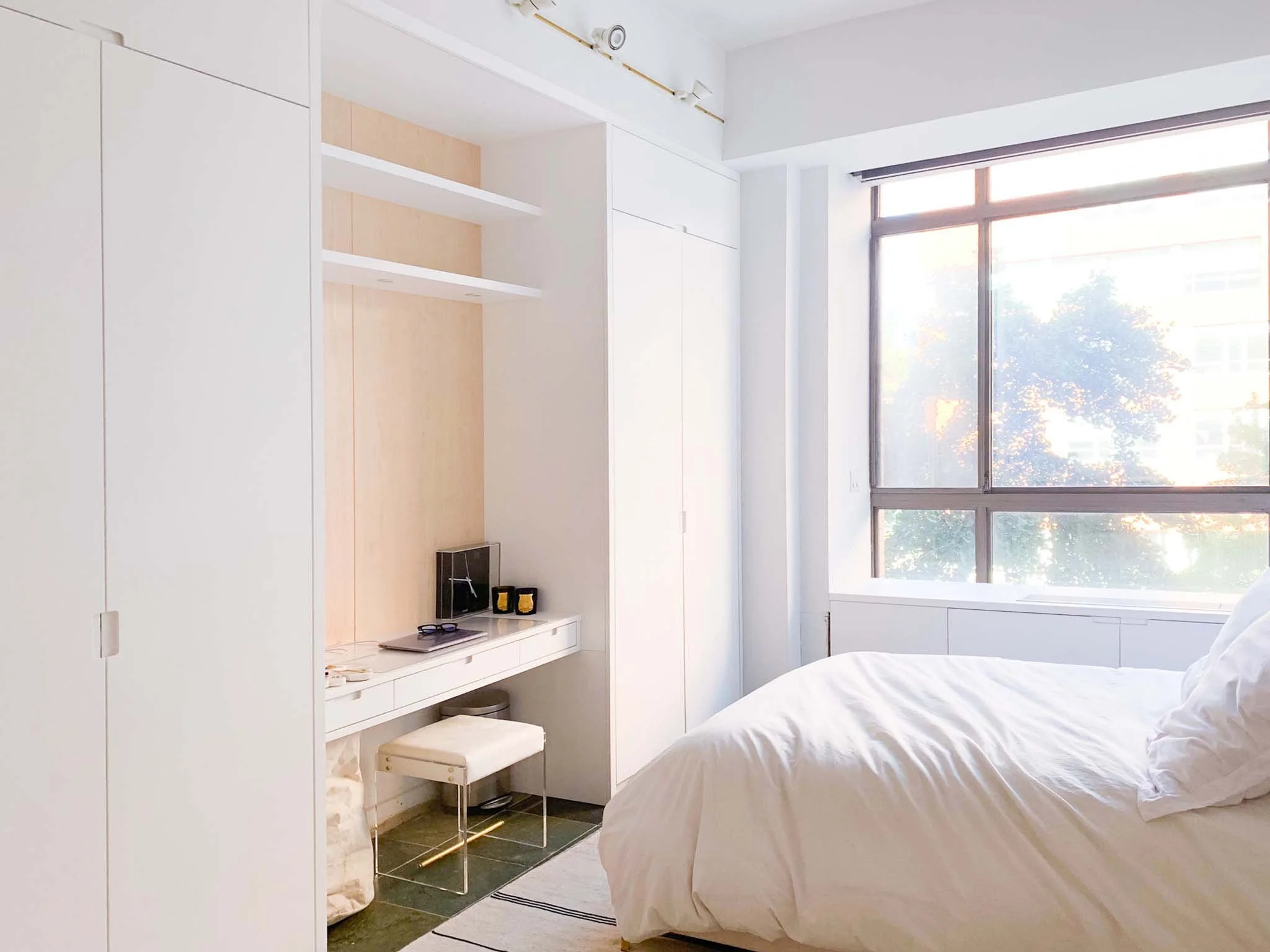 A small vanity desk in the bedroom