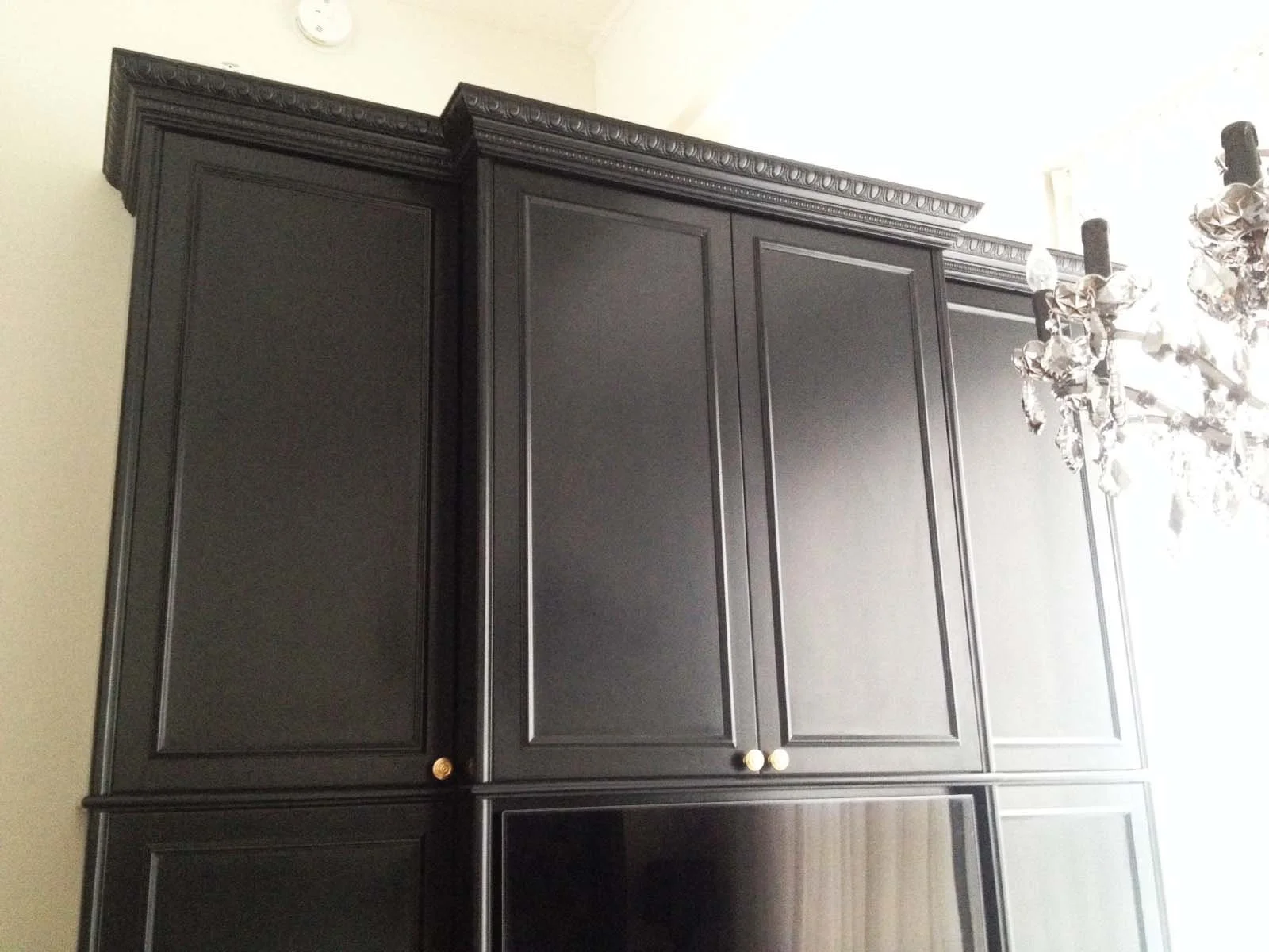 A glamorous dark bedroom cabinet