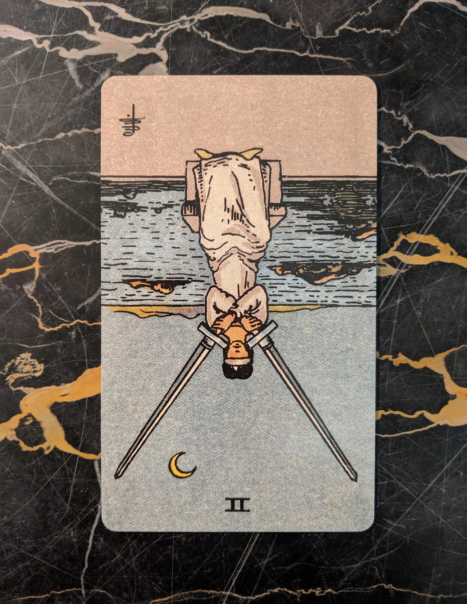 This card is from the Rider-Waite deck, published in 1909, borderless edition