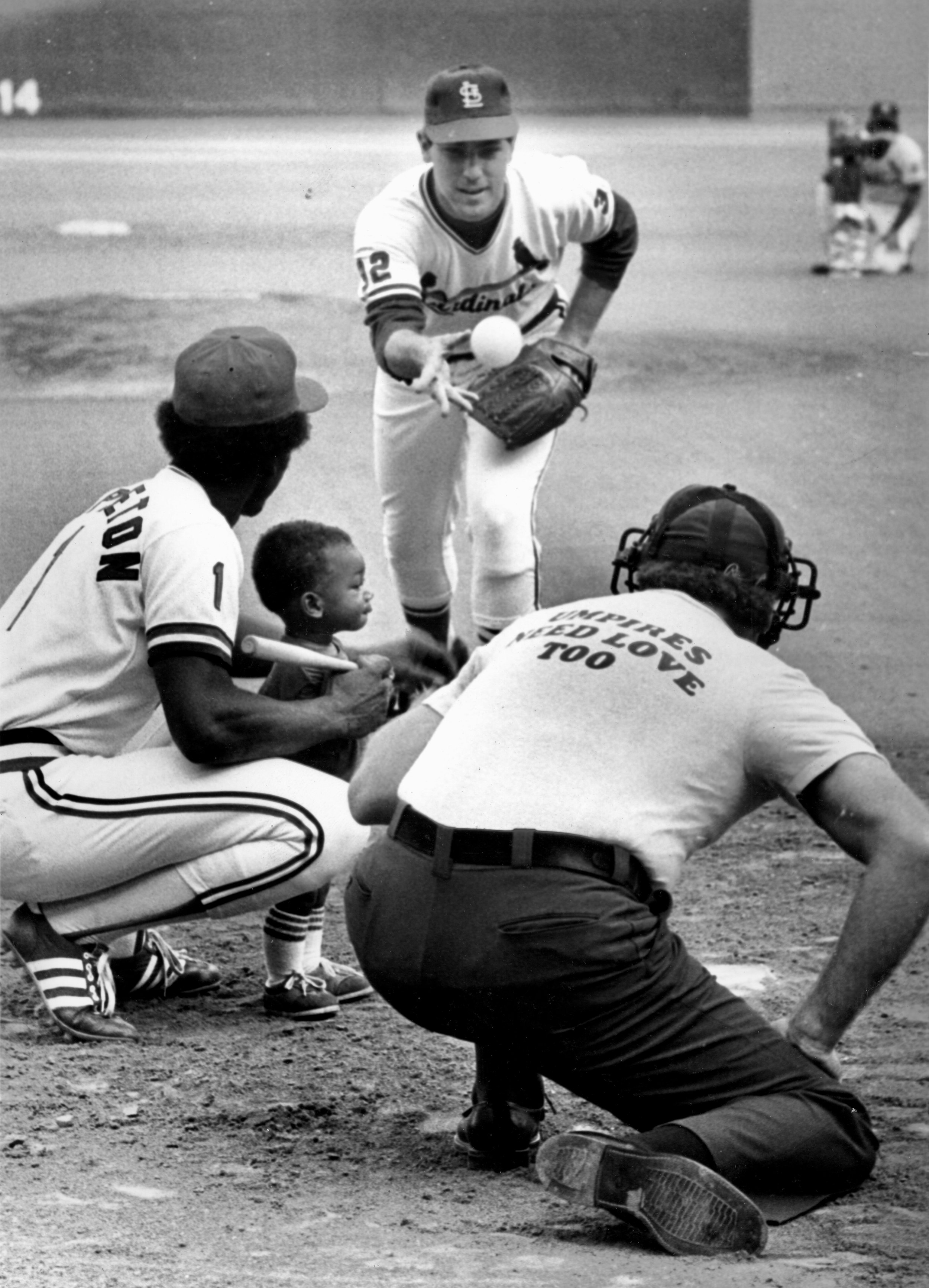 Mark throwing to Garry Templeton's son on Cardinals Family Day, 1979 or 1980