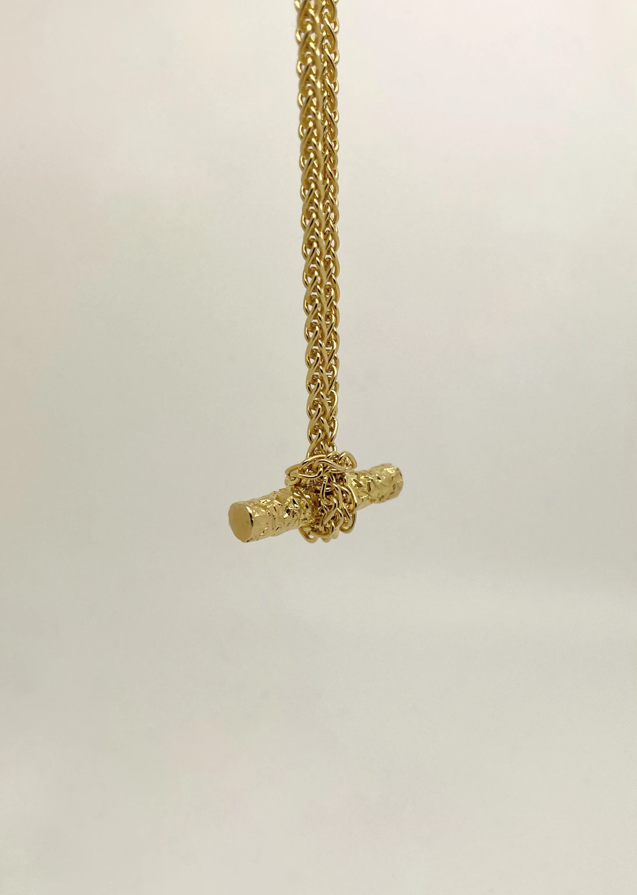 Modern day classics, our take on the iconic T Bar necklace, I single bar held by a knotted chain