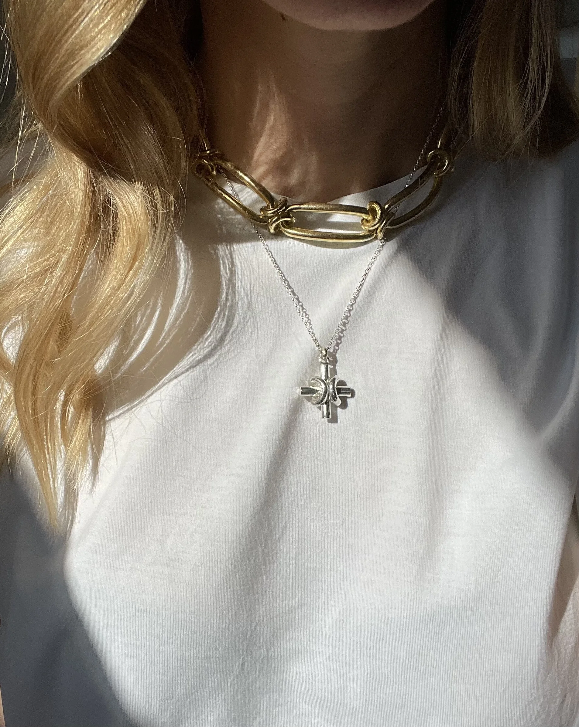 Chunky gold chain necklace layered with a gold and silver mix cross pendant. (Copy) (Copy)