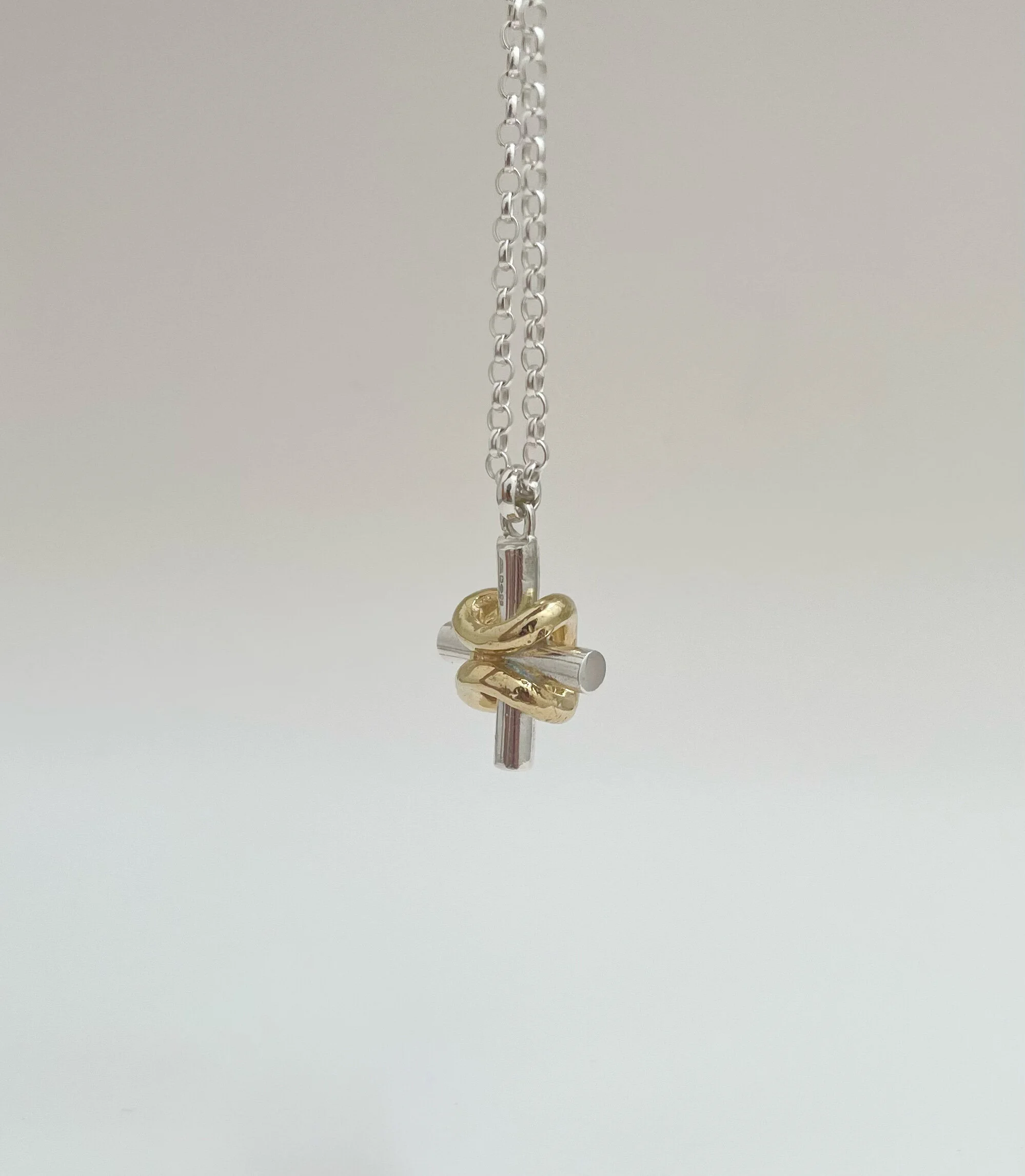 An equal armed cross pendant