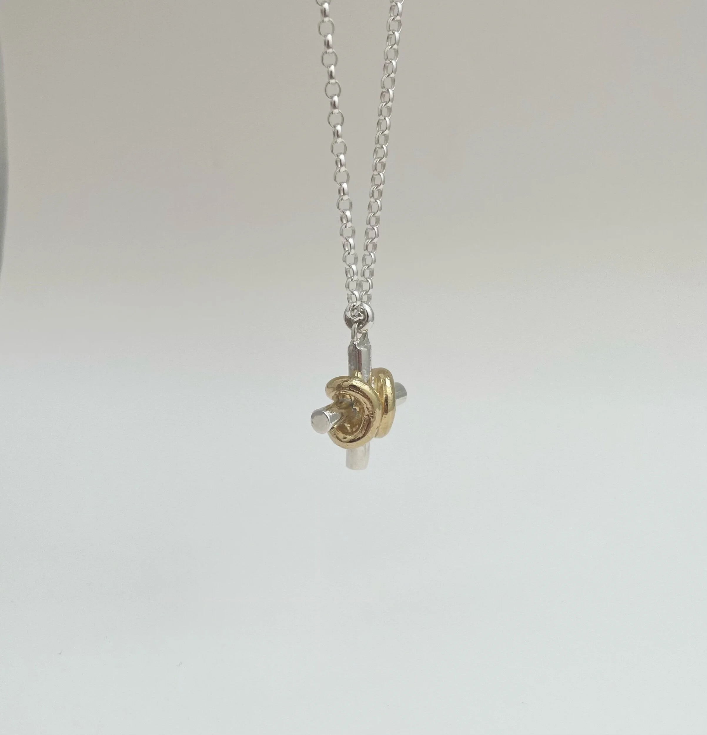 a chunky silver cross necklace