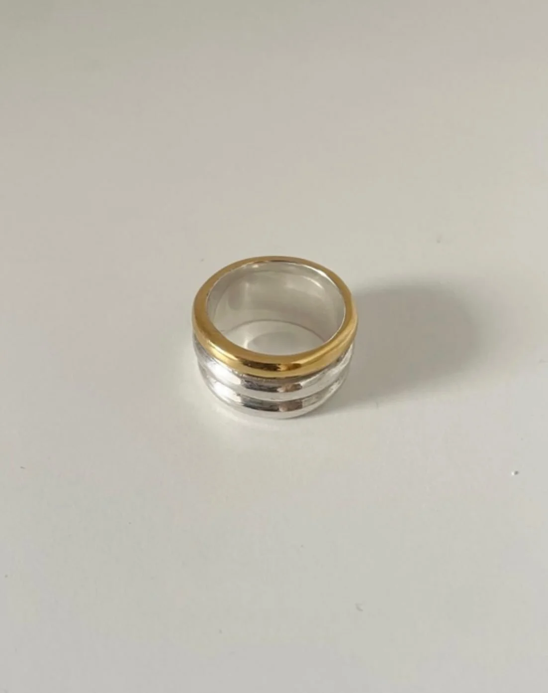 The RIZZO RING 💛🩶Coming Soon. 
Solid sterling silver tipped in 18 Carat gold plate. Handcrafted in London. 
DM to pre-order.