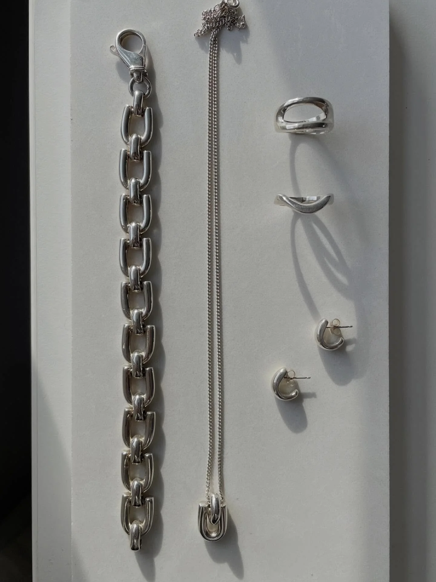 Uma and friends in sterling silver 🤍

Uma chain bracelet 
Uma pendant
Beau ring
Mara ring
Silver ear huggers 

Available at www.ruddockjewellery.co.uk

#solidsilverjewellery #chunkysilverjewellery #silverlovers