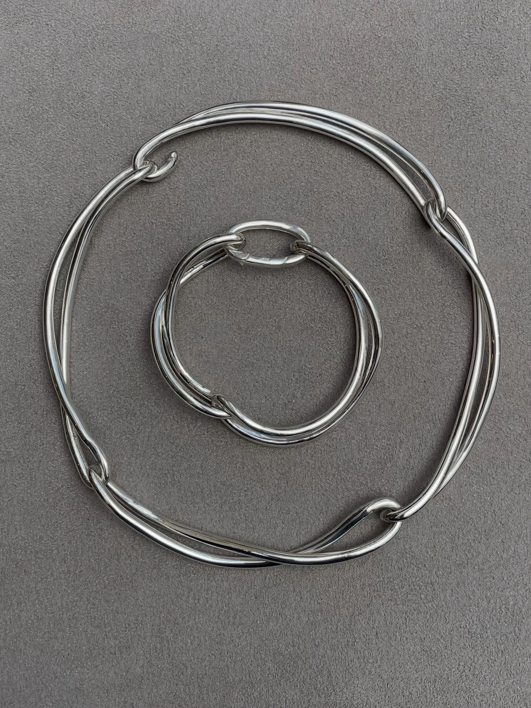 Heavy metal made fluid. The Soma bracelet &amp; Delphine collar handcrafted in solid sterling silver.