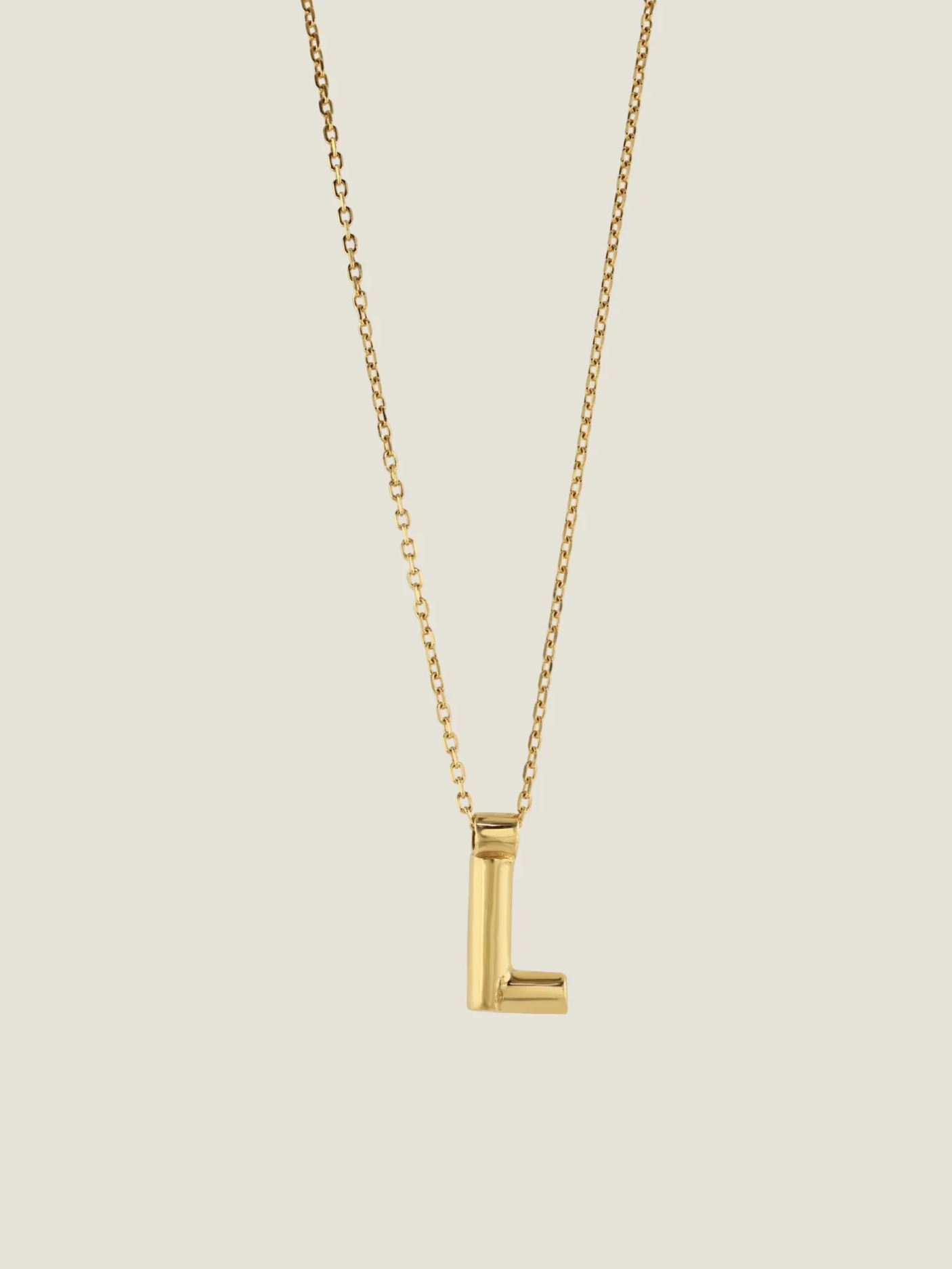 initial pendant necklace in gold by Ruddock jewellery