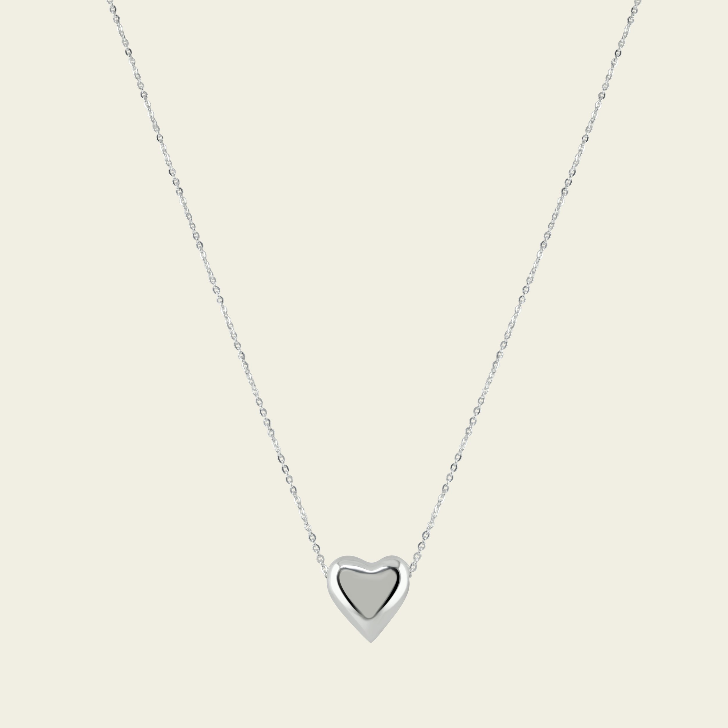 A SILVER HEART PENDANT