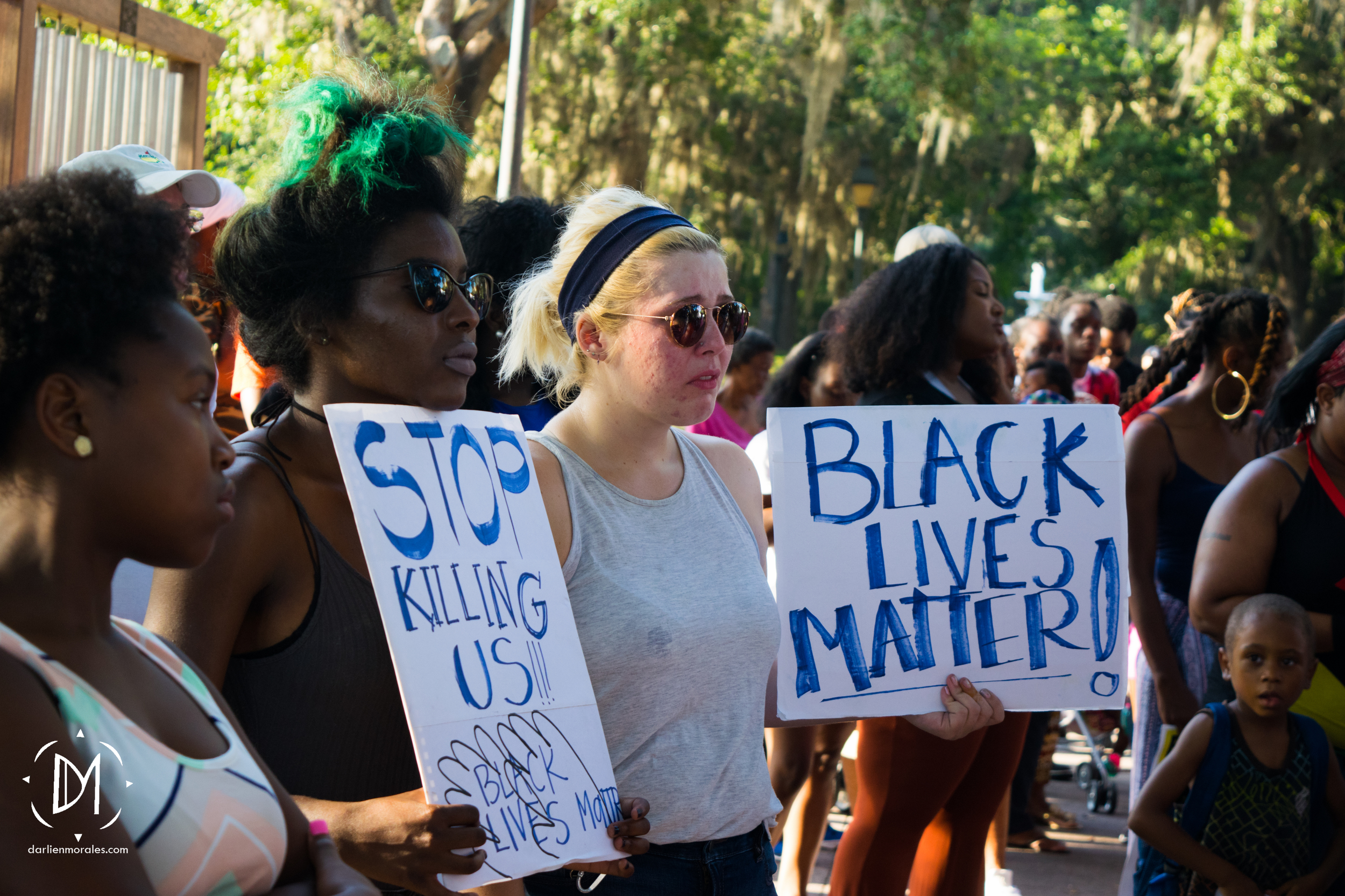  Crying activists mourn the lost lives at the Black Lives Matter Vigil.  -July 12, 2016 