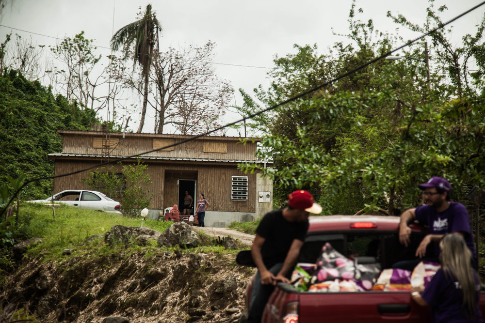  American Leading Finance (A.L.F.) employees volunteer to deliver goods in Utuado. 