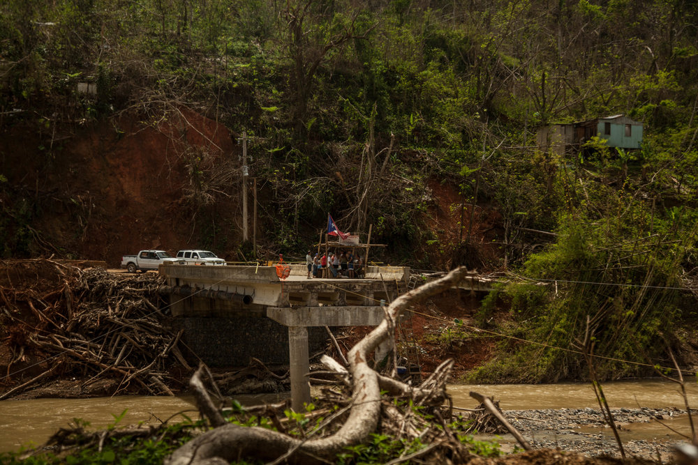  Use a shopping cart to transport goods in and out of Charco Abajo, Utuado. 
