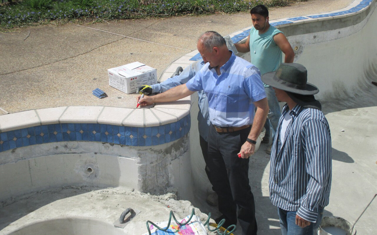  Supervision, education, and guidance are cornerstones of the Browning Pool &amp; Spa process. Here Chuck Browning is discussing why we place the foam joint behind the coping and how important it is that no grout material remains between the coping a