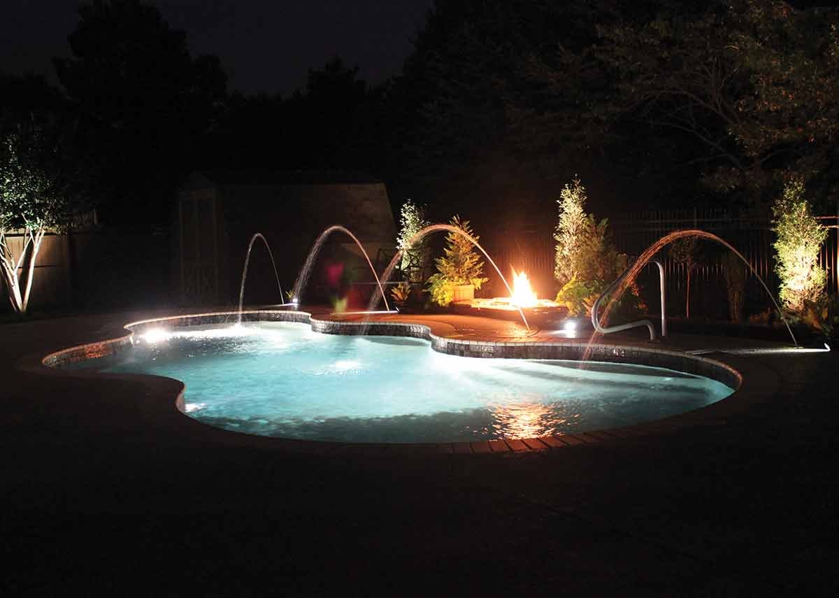 Axiom-16-patio-jets-fiberglass-pool-night.jpeg