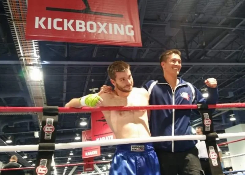 Poore with Coach Mark Greubel 