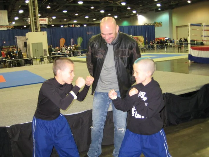 A couple of students posing for Dana WHite.