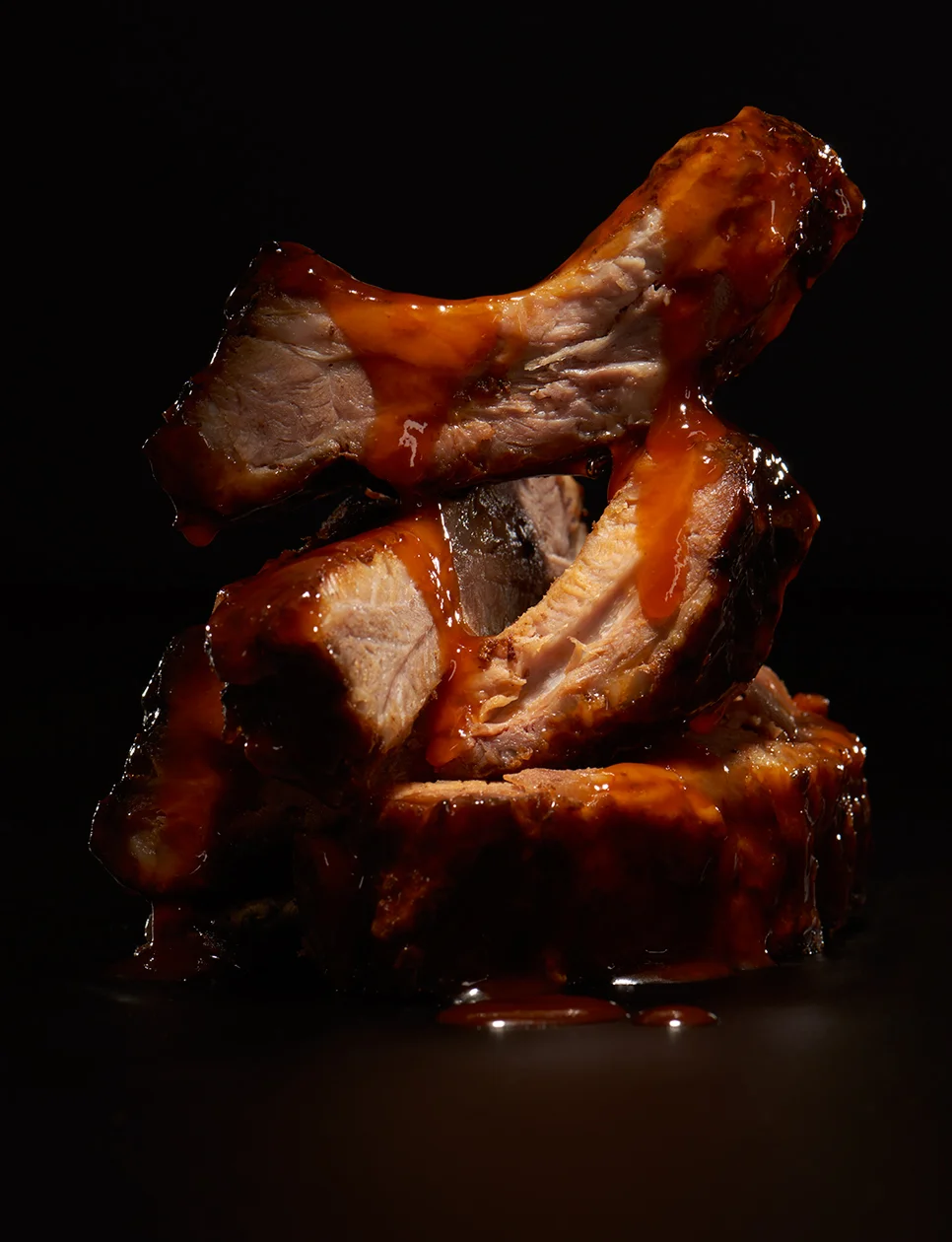 Stacked Ribs with Dripping BBQ Sauce Flashlight Studio Chicago