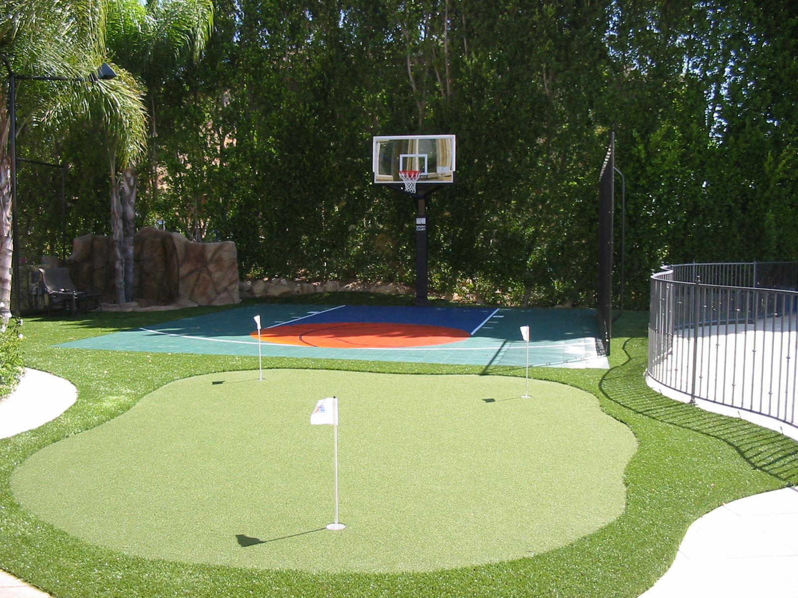 Low maintenance landscape with Sport Court