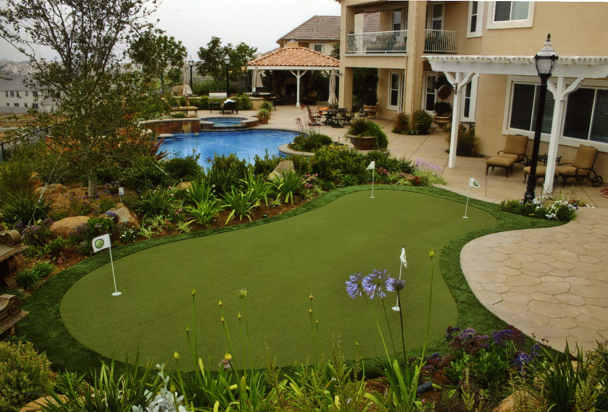 Synthetic grass and pavers