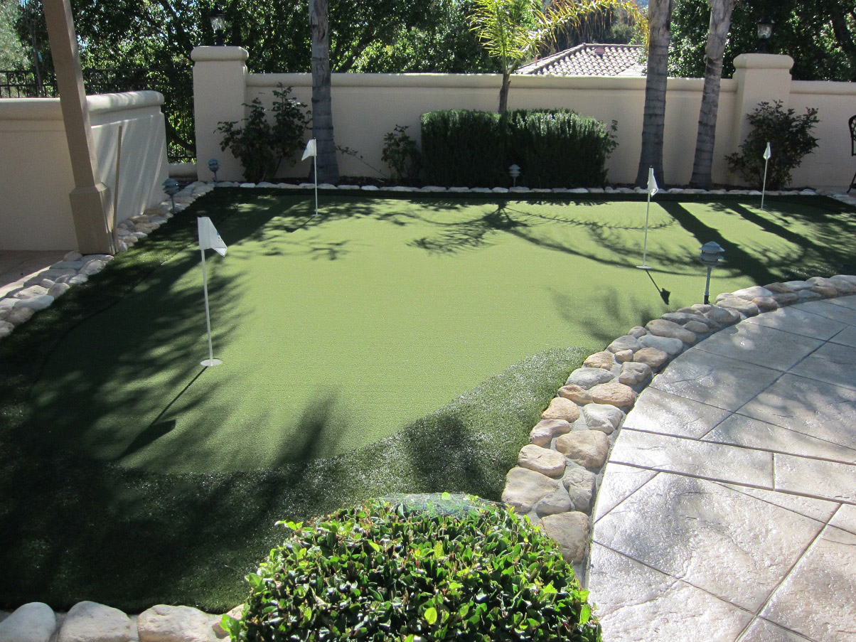 Synthetic grass and pavers