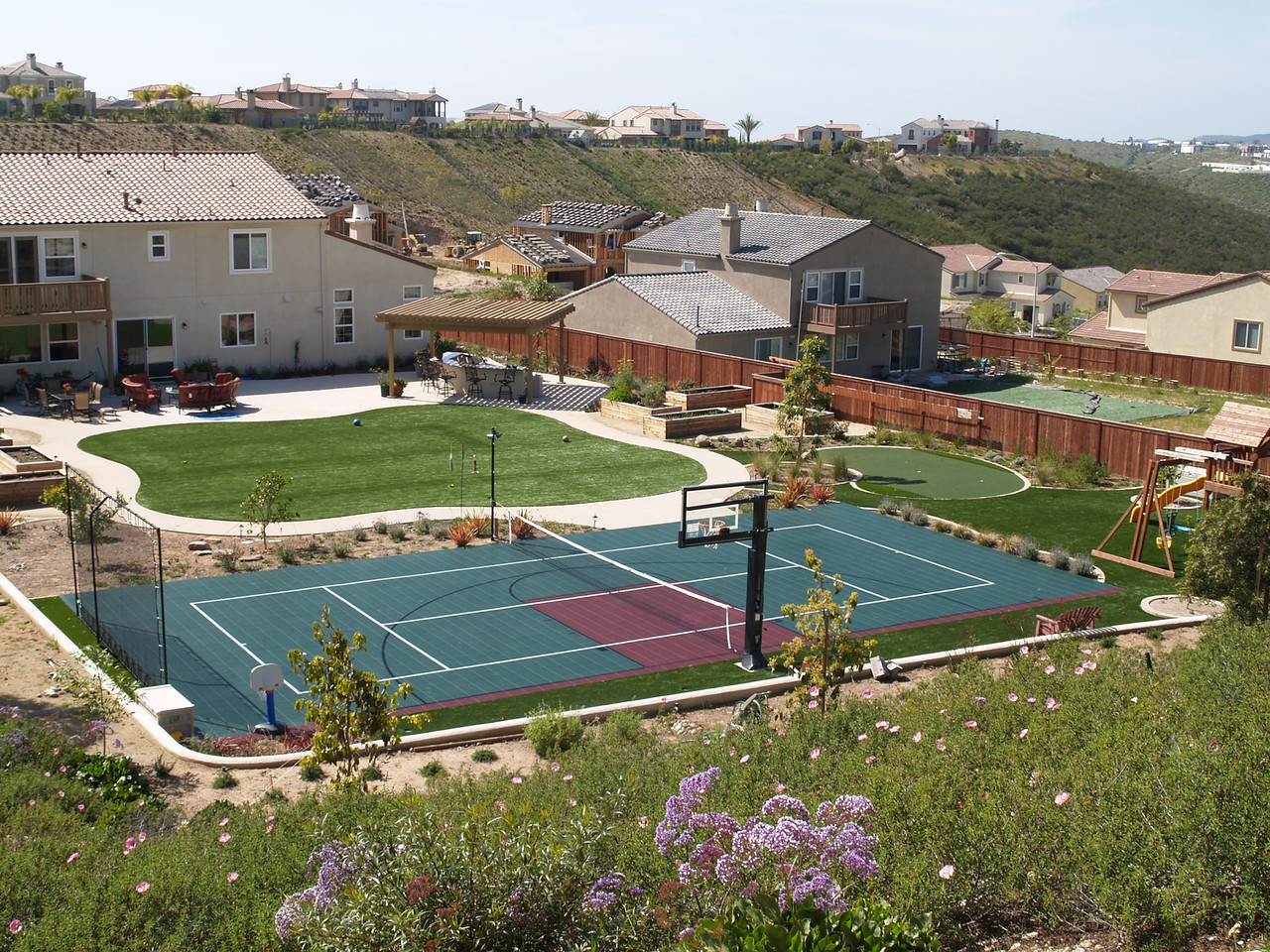 Low maintenance landscape with Sport Court