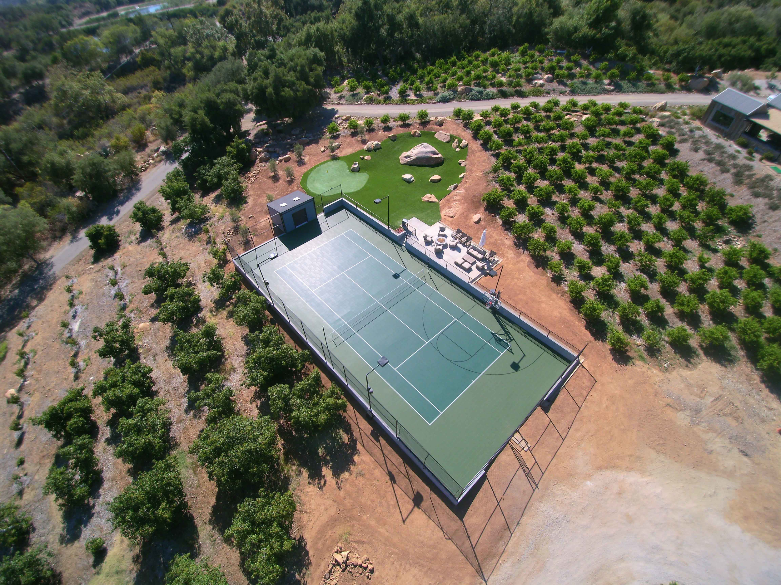 Low maintenance landscape with Sport Court