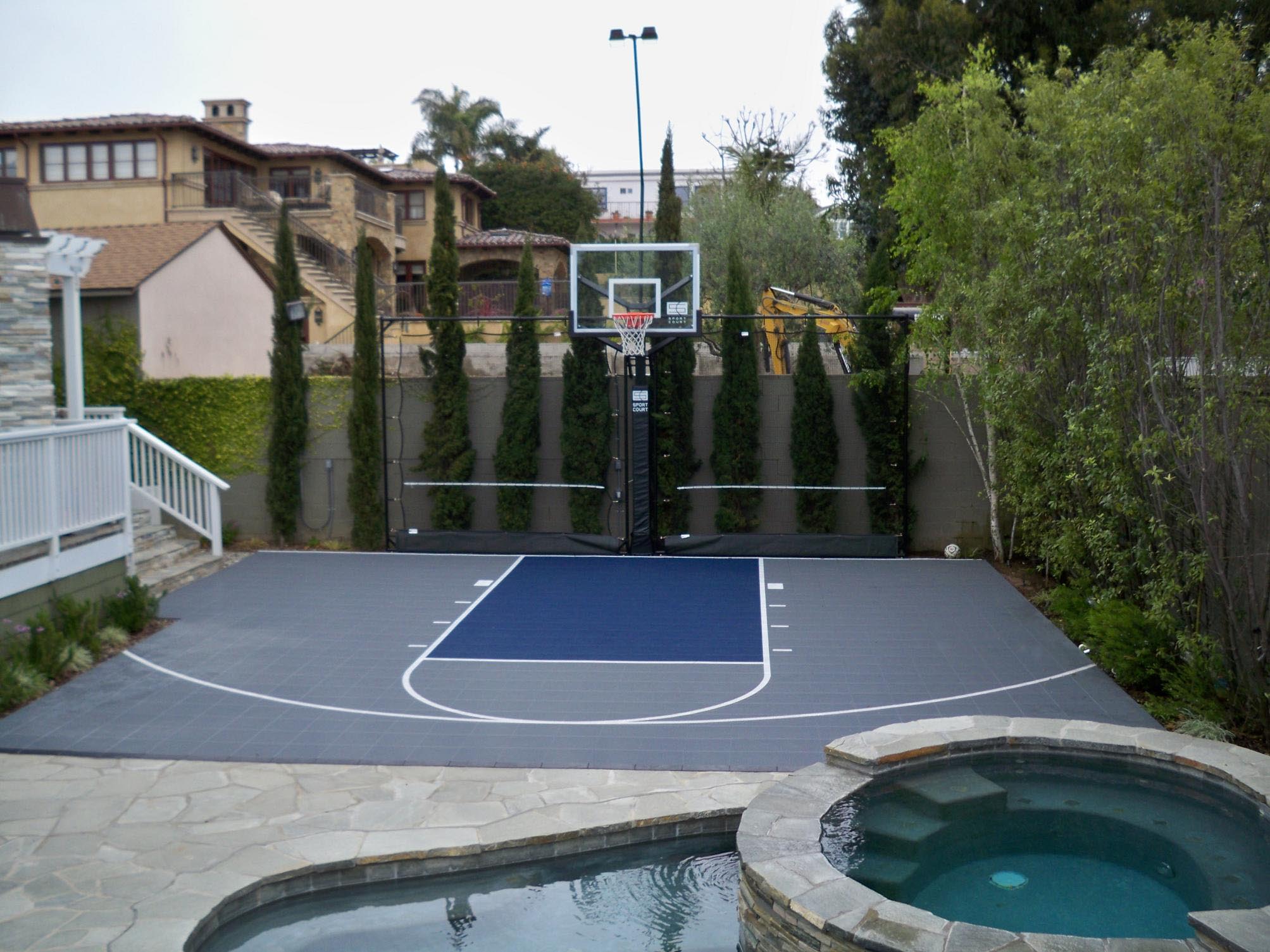 Low maintenance landscape with Sport Court