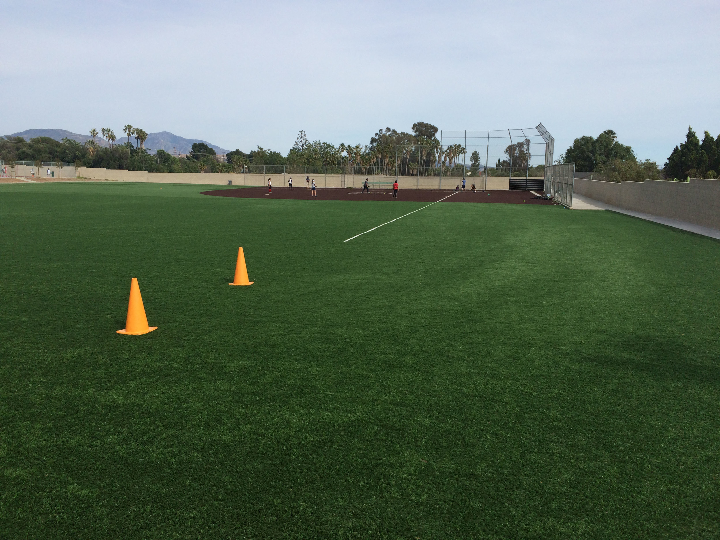 Synthetic artificial grass baseball field