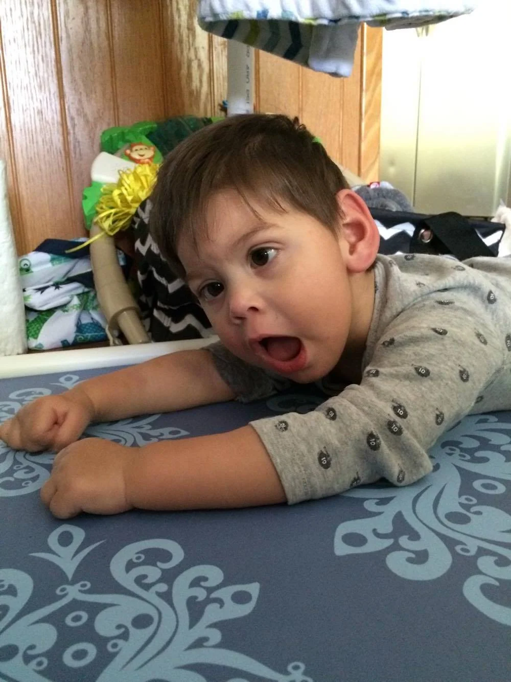 Maxwell propping himself up on his forearms for the first time at 19 months old.