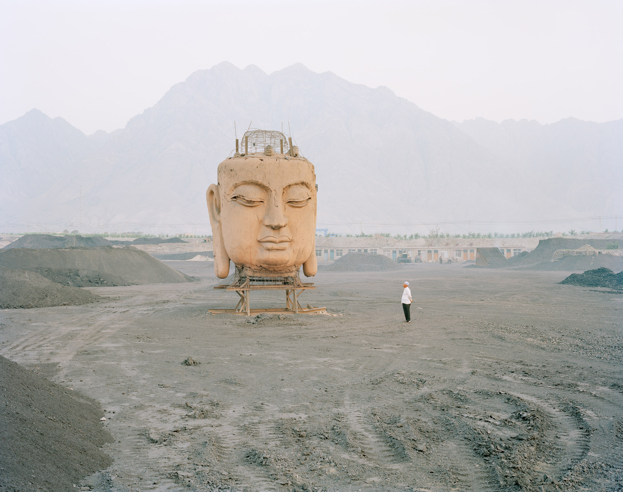 A giant Buddha's face in coal yard, Ningxia province.
