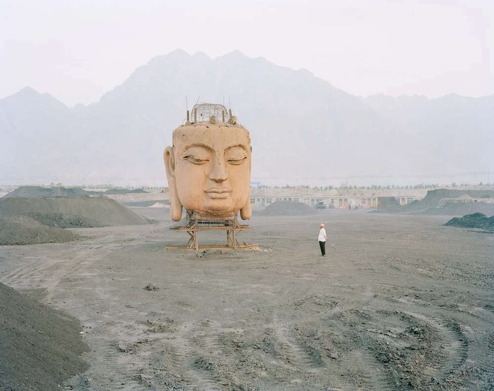  A giant Buddha's face in coal yard, Ningxia province. 